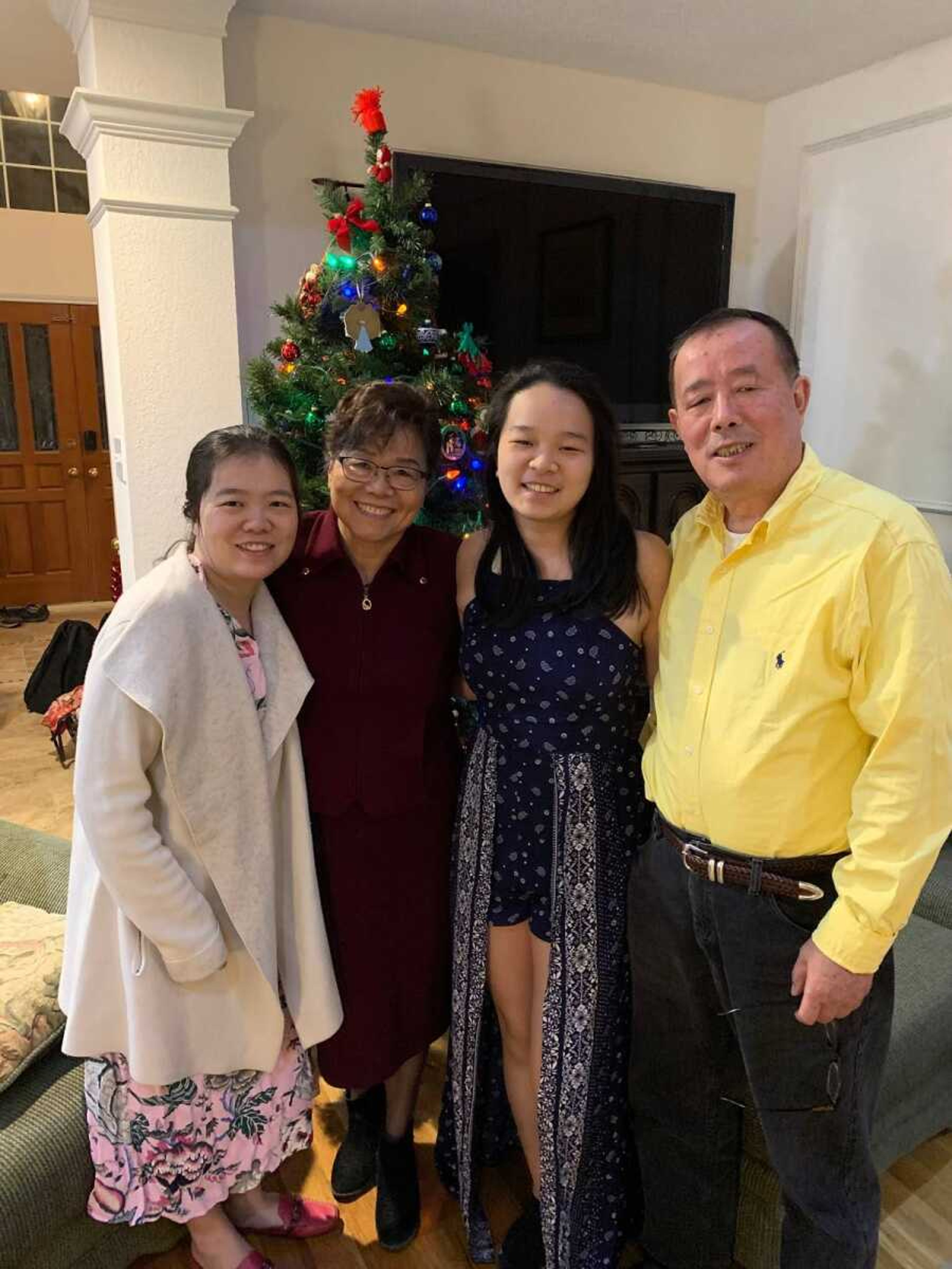 From the far left, daughter Bonan Wang, wife, Yifeng Ren and daughter, Ellen Wang stand with Dr. Shaijum Wang for a family photo in this undated image. 