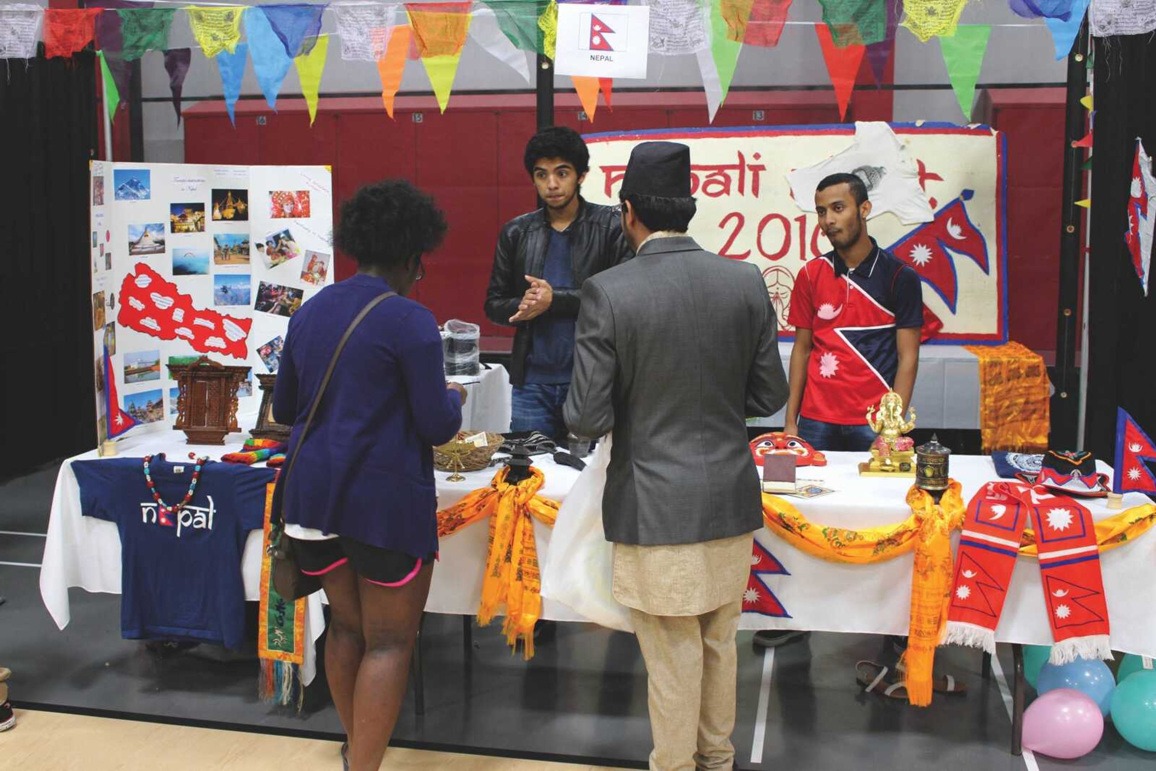 Students check out the Nepal booth at the International Festival on April 23.