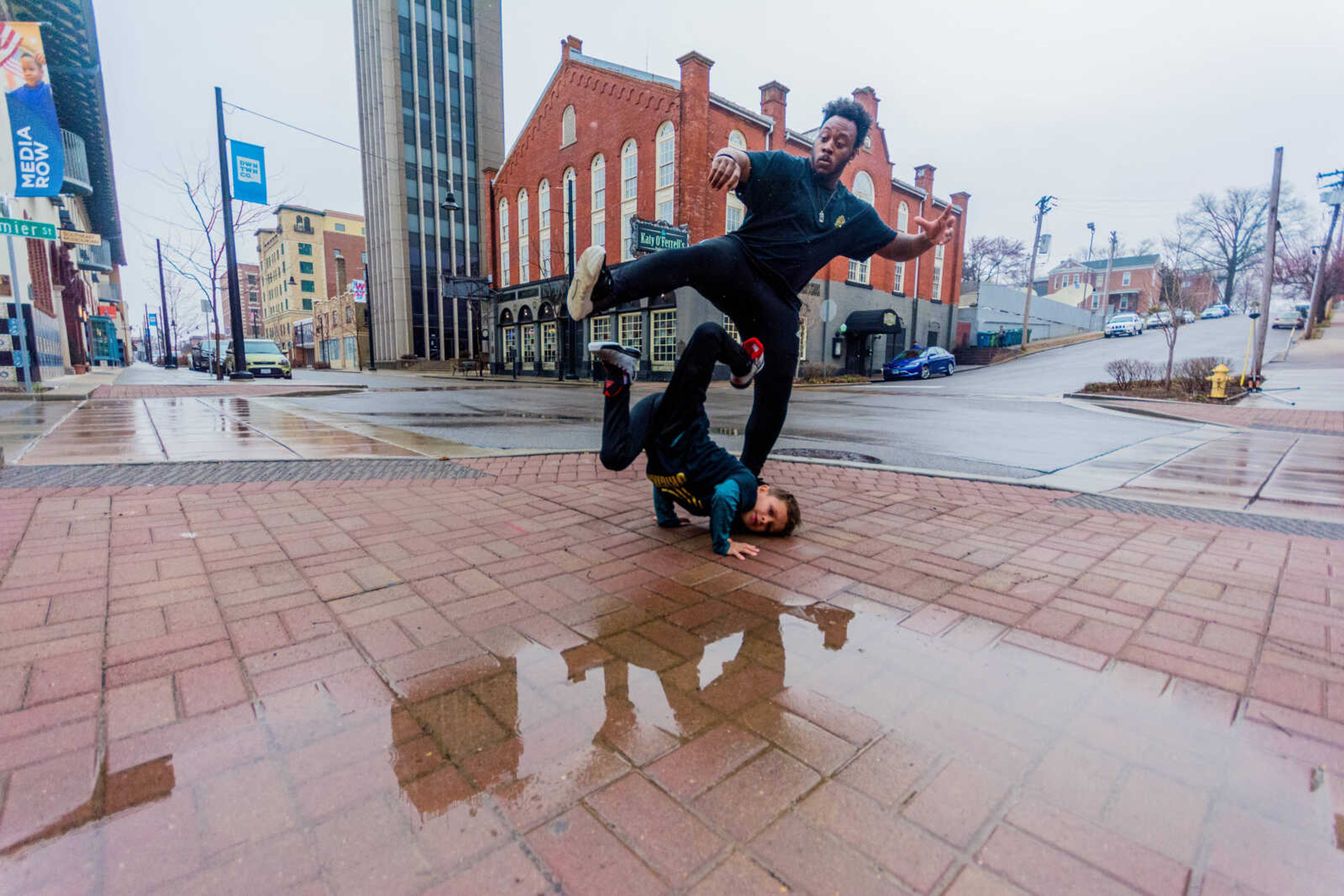 Christopher Guada and Micheal "Crank" Curry dance in downtown Cape Girardeau.