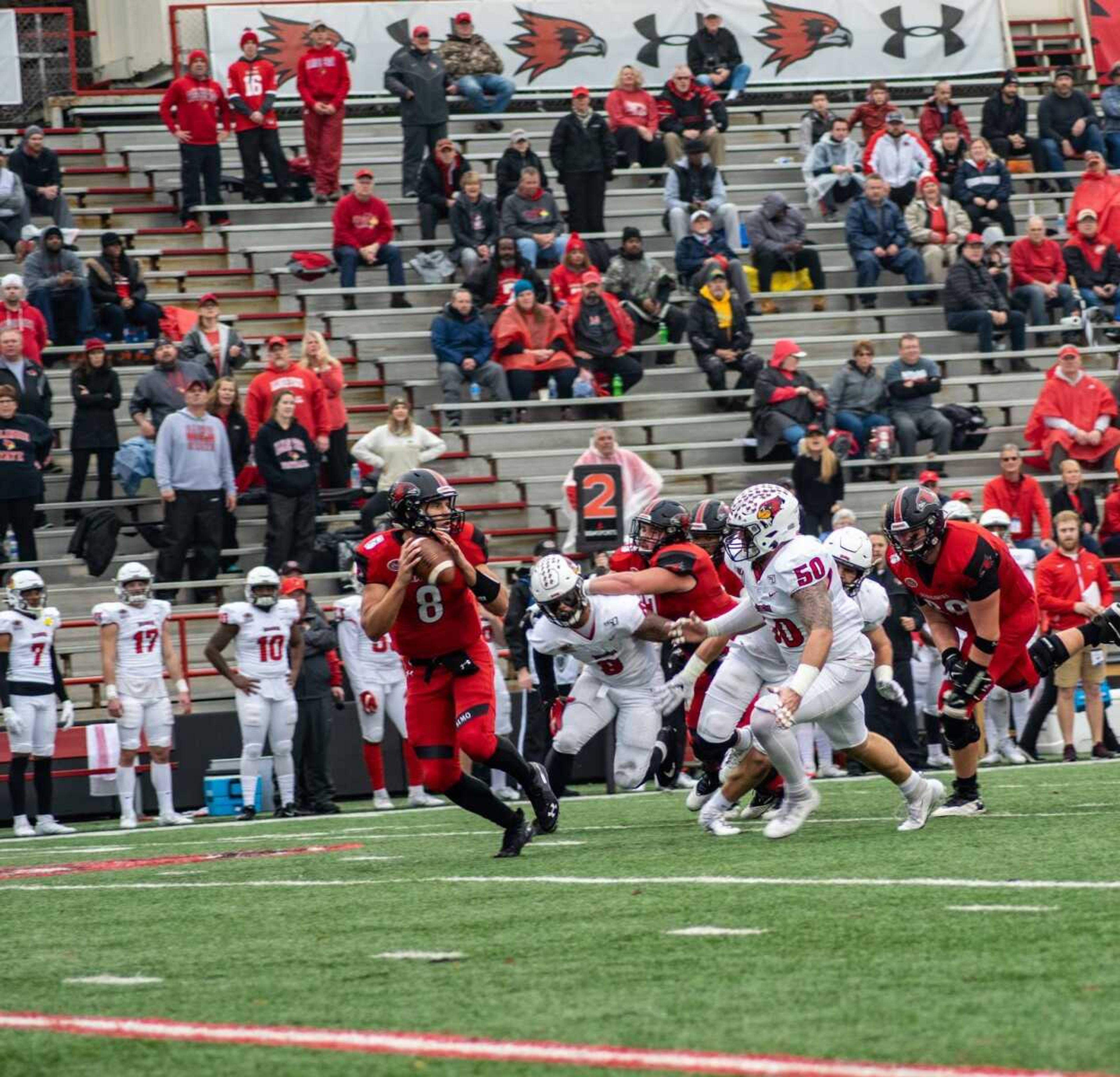 Sophomore quarterback Joe Pyle evades an Illinois State defender in the Redhawks 24-6 loss on Nov. 30 at Houck Field.