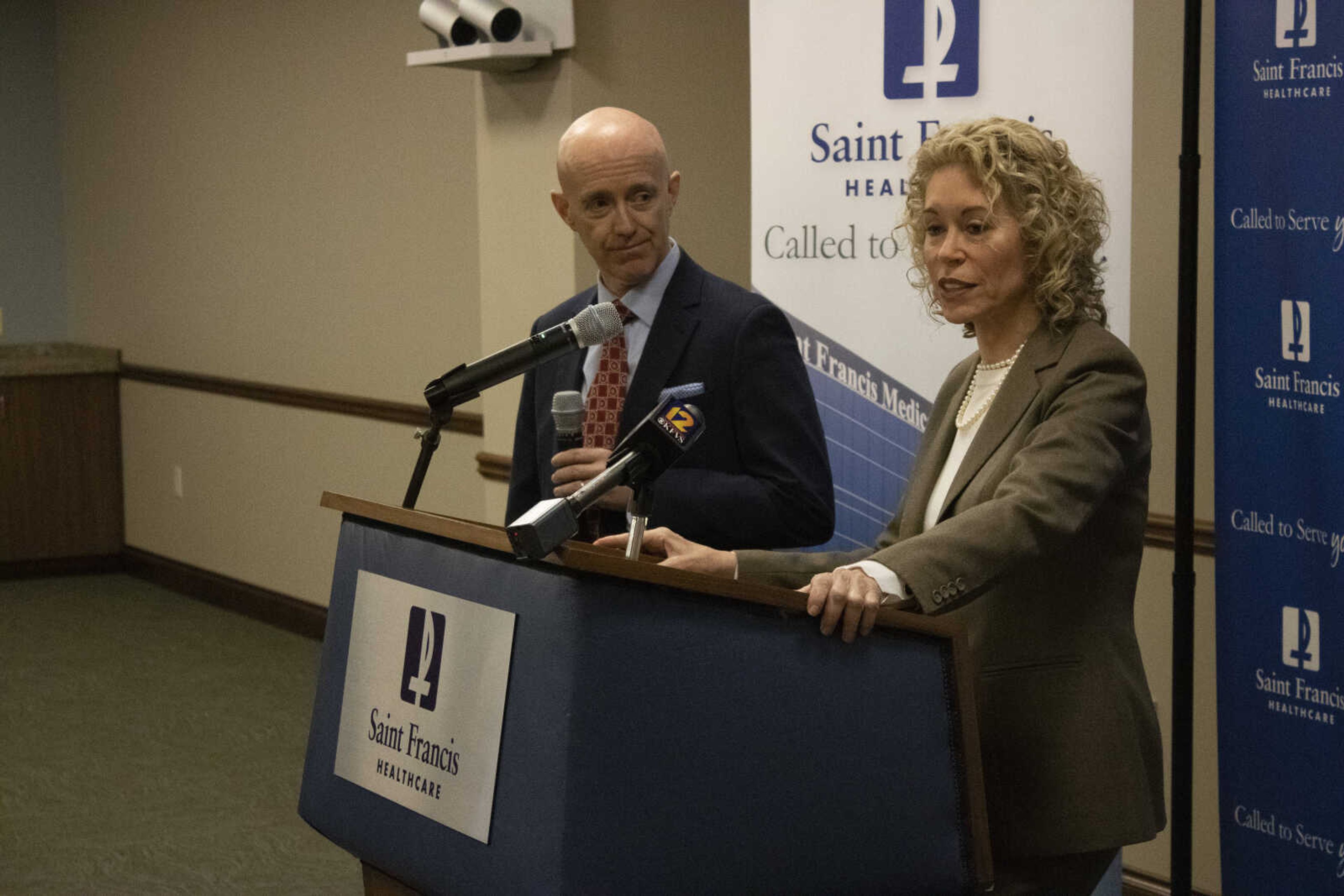 Jim Burke, left, and Maryann Reese discuss Saint Francis’ terminated contract with UnitedHealthcare at a press conference Monday, Jan. 27.
