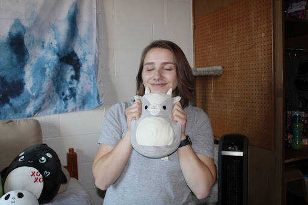 Bowles poses with a goat Squishmallow. “When I picked out Stan Lee, I just kinda latched onto it. I think it is the cutest Squishmallow, and it was there through some really hard times,” Dominica Bowles said. “I didn’t have many friends a year ago, and so that was the only thing there during some dark times. I’ve had him for almost three years now, and it is still always by my bedside.” 