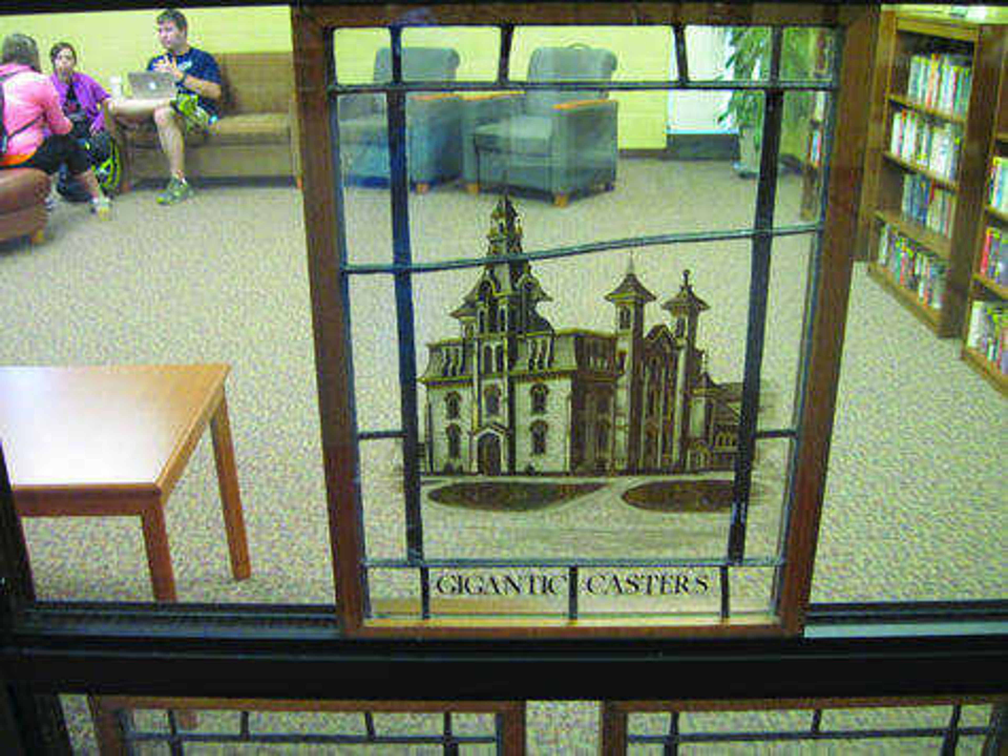 One of the panels from the stained glass collection to be displayed bears the title "Gigantic Casters." Photo by Andrew Tyahla