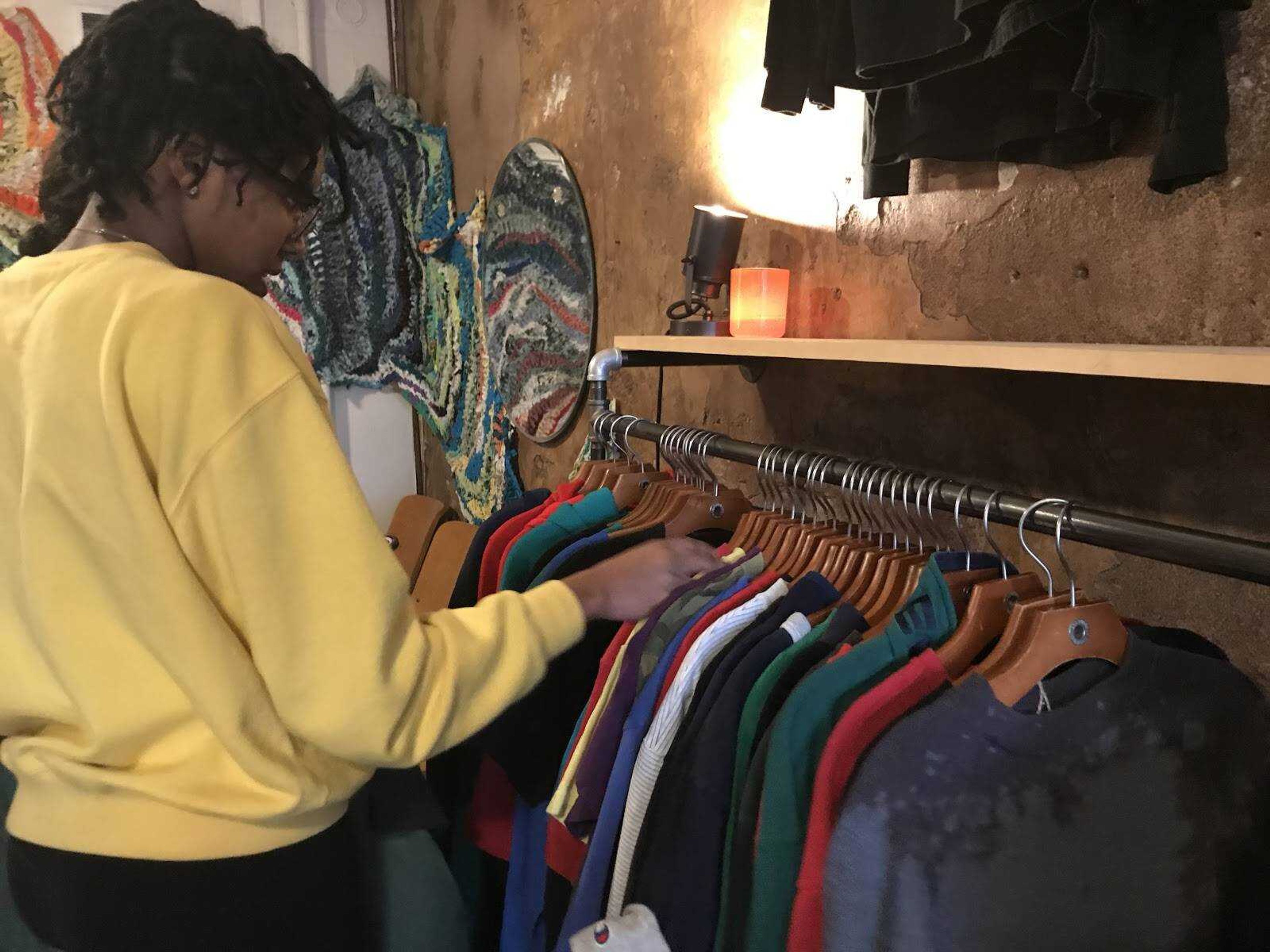 Shoppers at Kith and Kin browse clothing racks during the Feb. 7 pop up shop featuring The Flower Boys Brand and Pocket Change Denim.