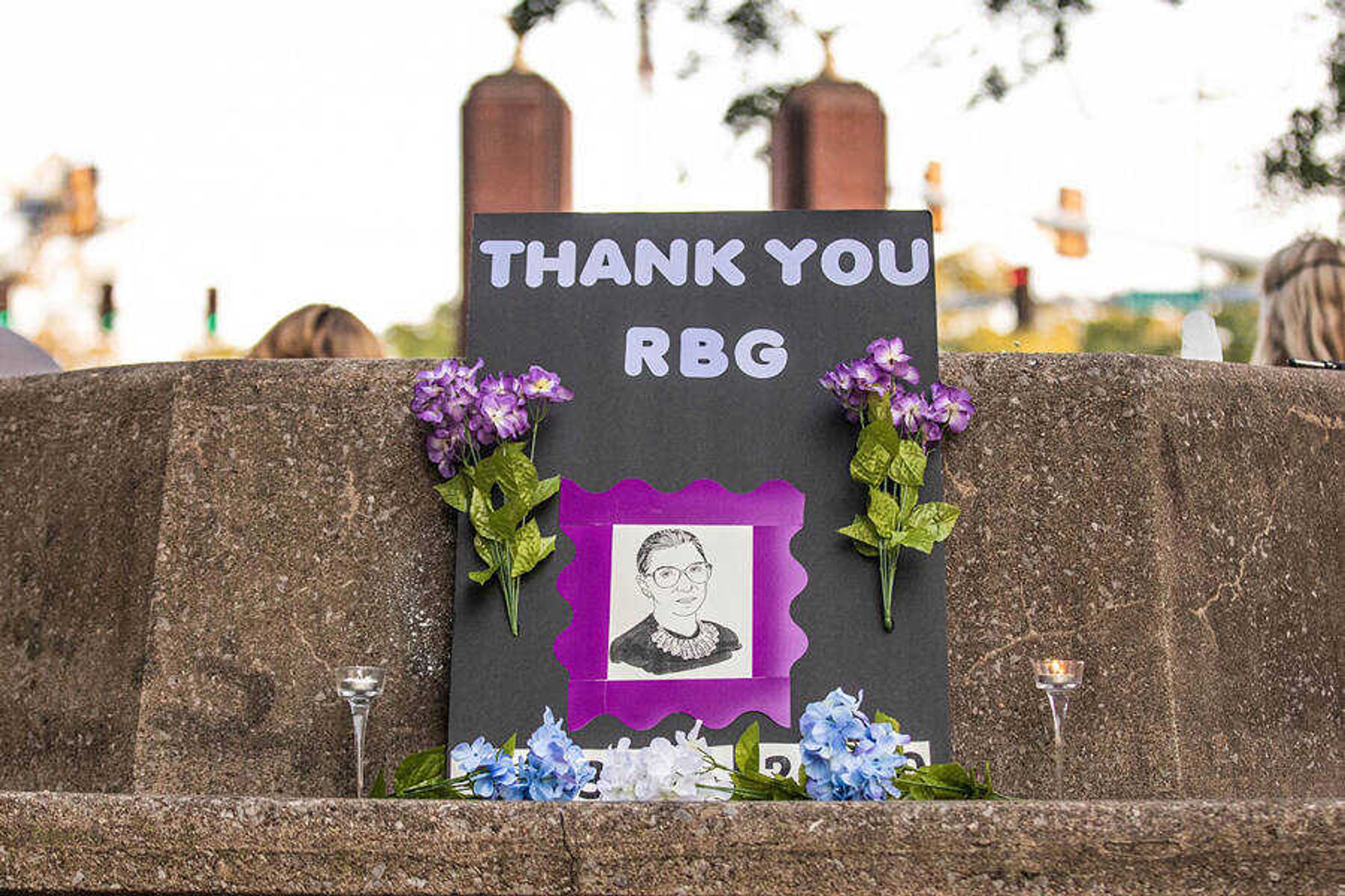 A tribute poster to Ruth Bader Ginsberg at a candlelight vigil in her honor on Sept. 20 at Capaha Park.