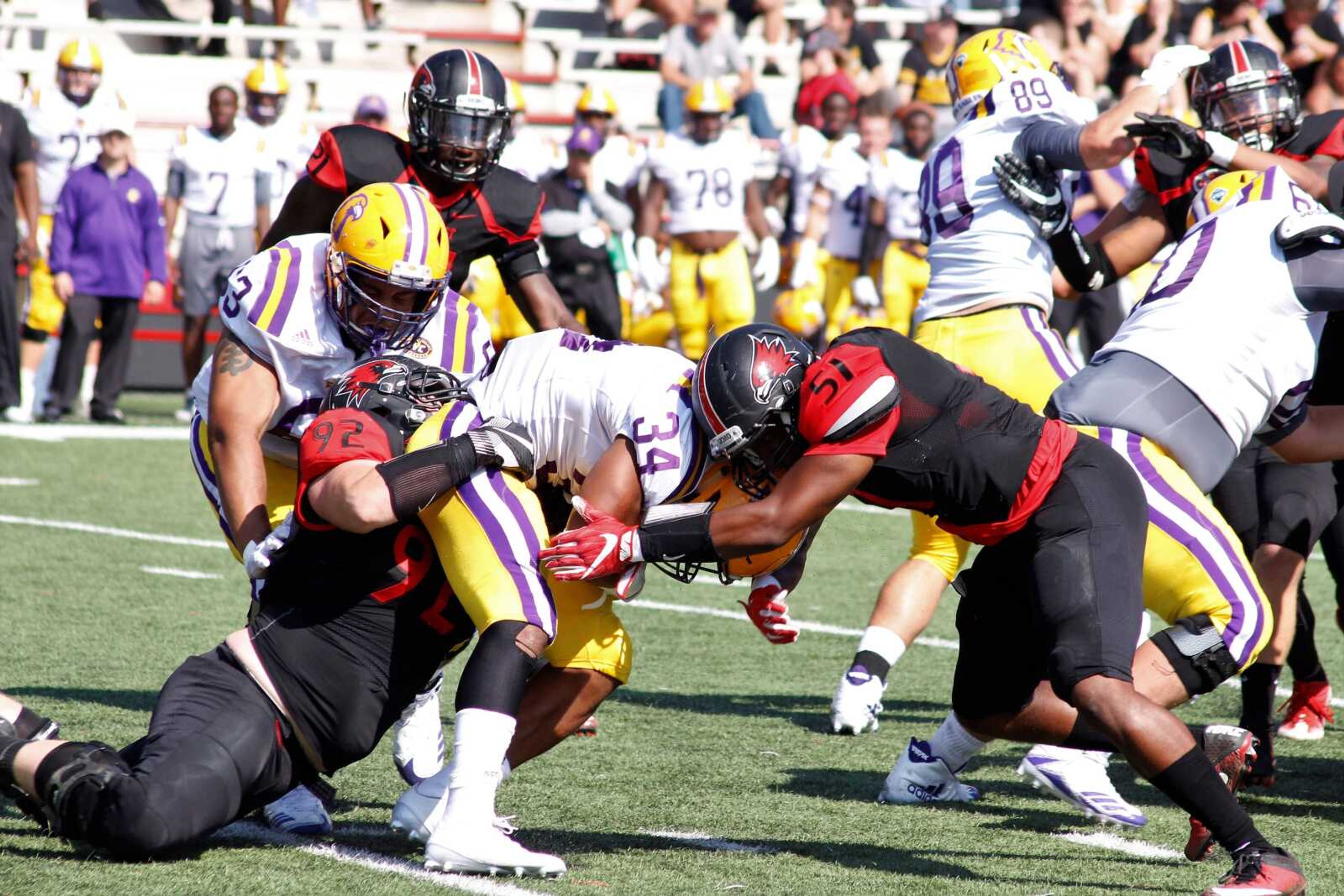Ryan Ochoa (left), and Demarcus Rogers (right) take down the Tennessee Tech quarterback during Homecoming.