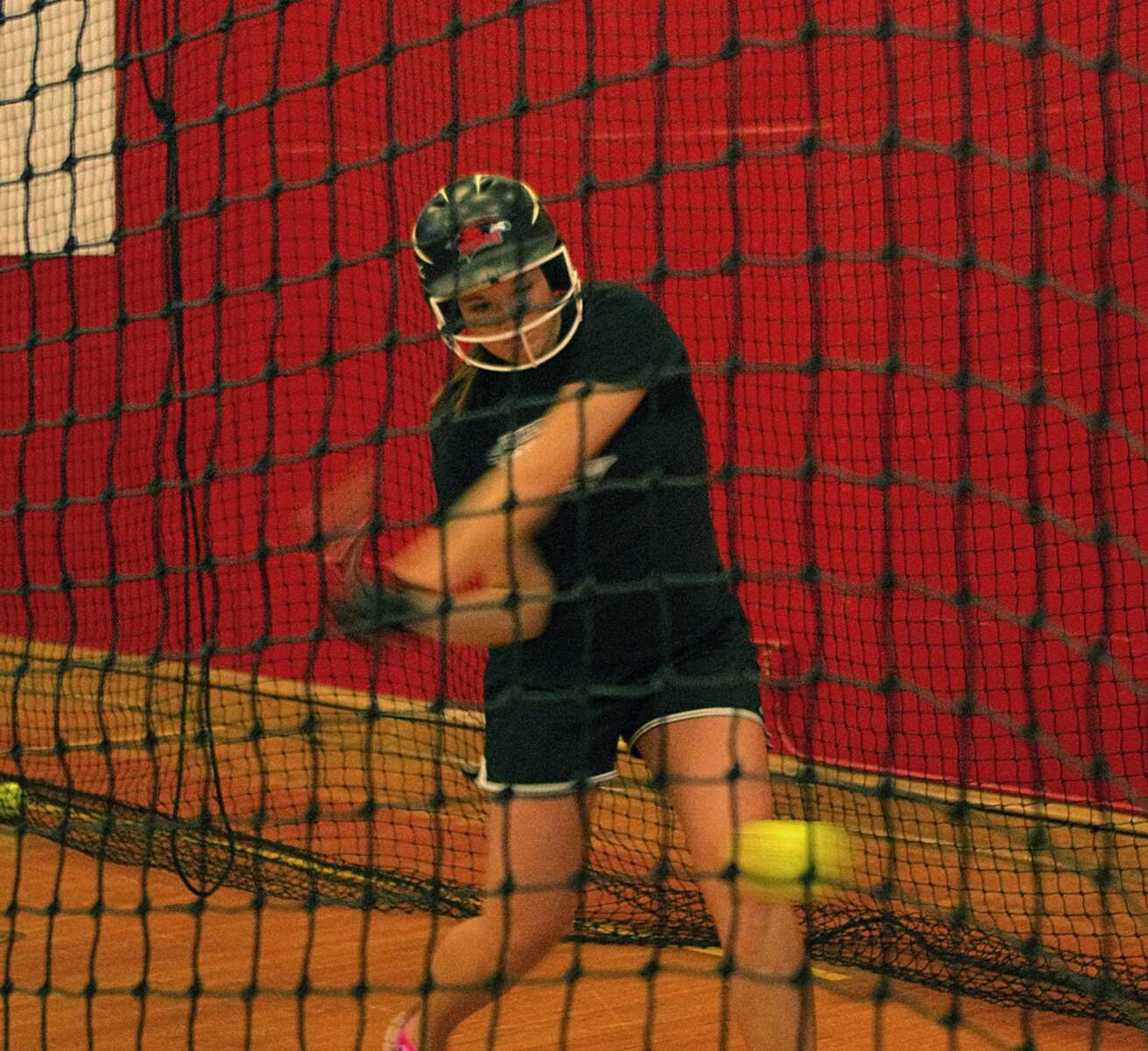 Taylor Cowan takes batting practice on Thursday in Houck Field House. Photo by Nathan Hamilton