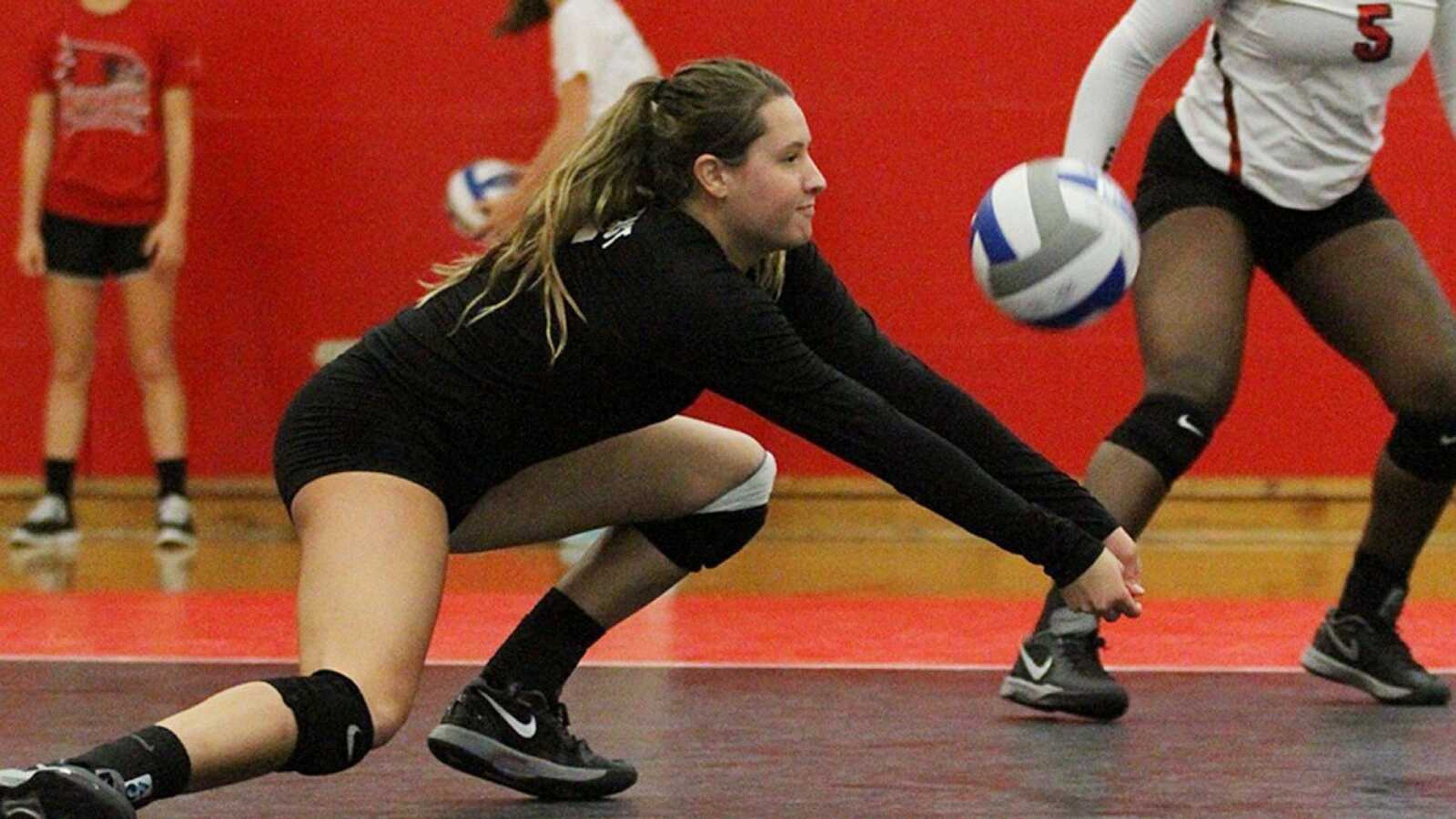 Senior libero Jade Mortimer makes a dig during a game last season. She is slated to be a leader on the women's volleyball team this year. Submitted photo