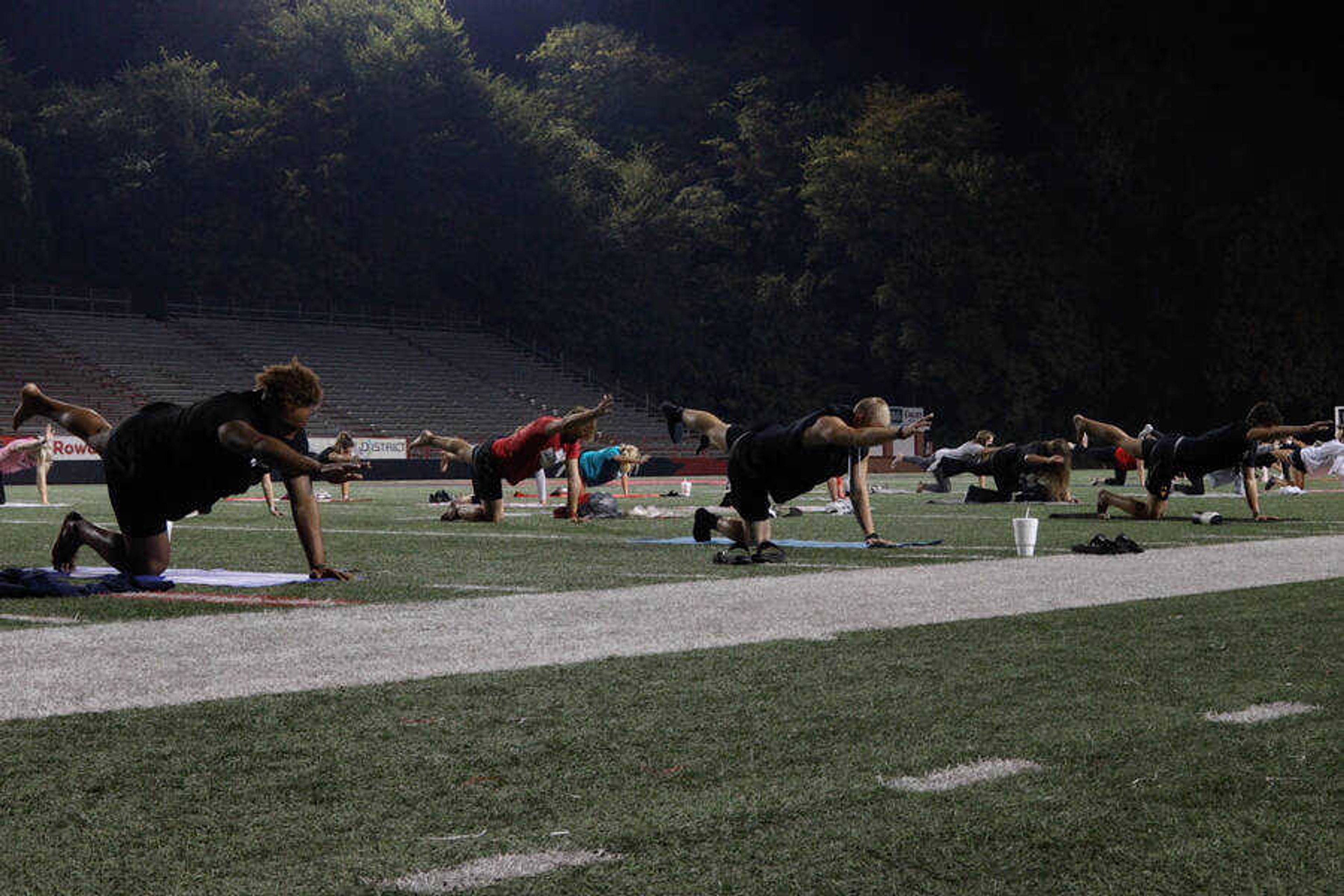 Southeast athletes participate in yoga at Houck Field, Thursday, Oct 8.