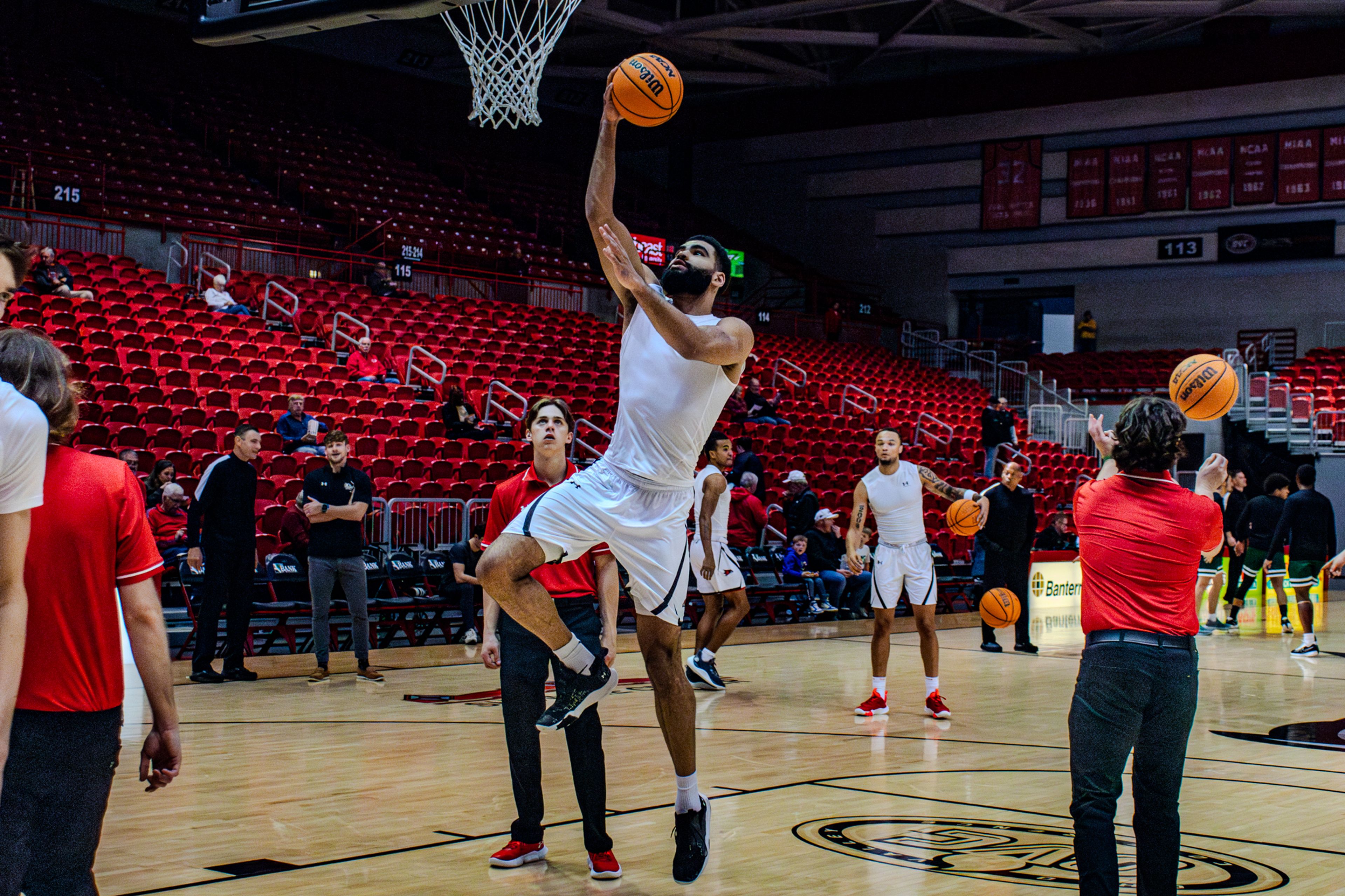 Junior center David Idada warms up in pregame against Crowley Ridge College. 