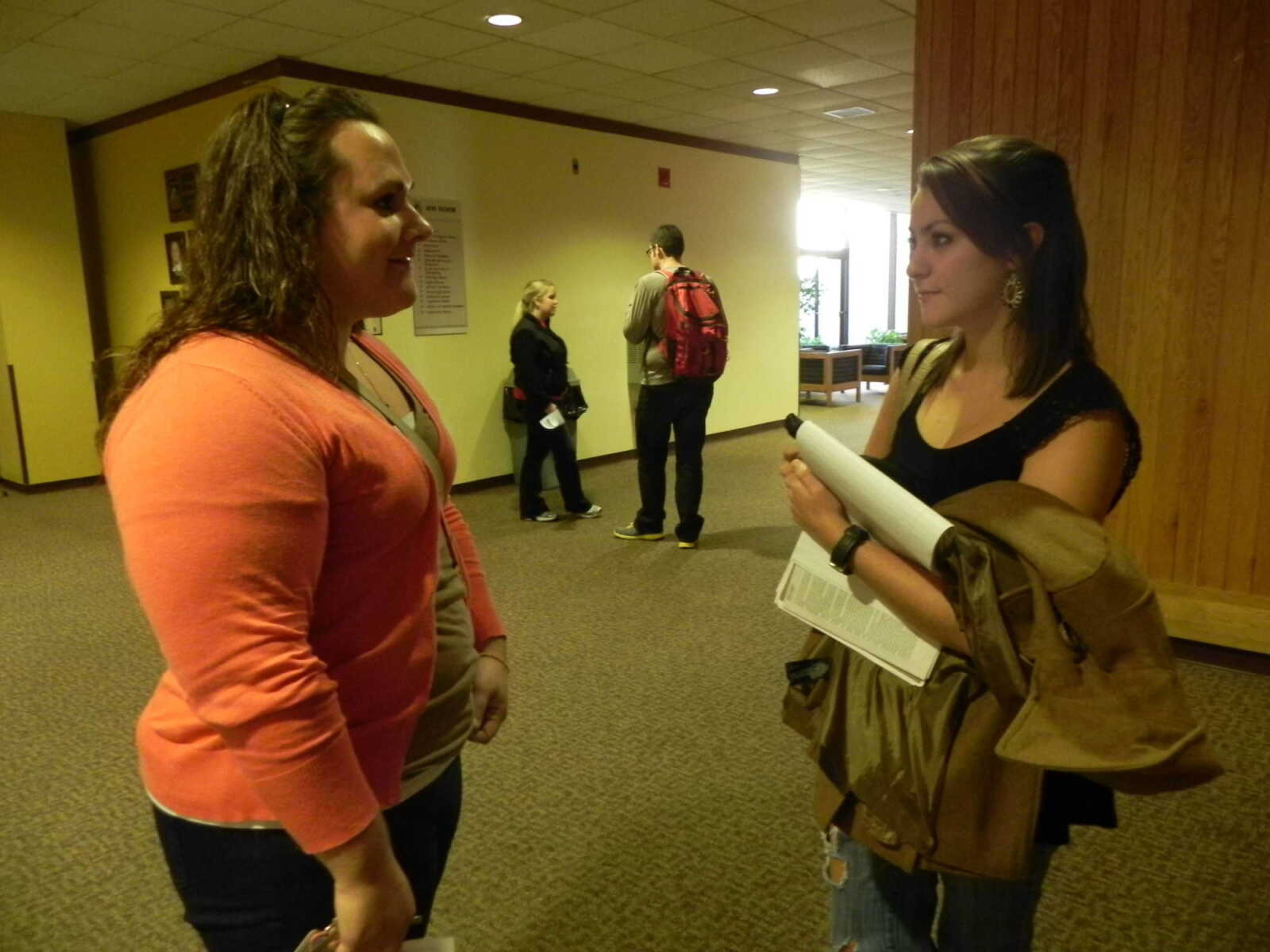 Logann Driskell, left, a resident assistant in Dearmont Hall, speaks with Arts and Entertainment editor Whitney Law, right. Photo by Kelsey Barksdale.