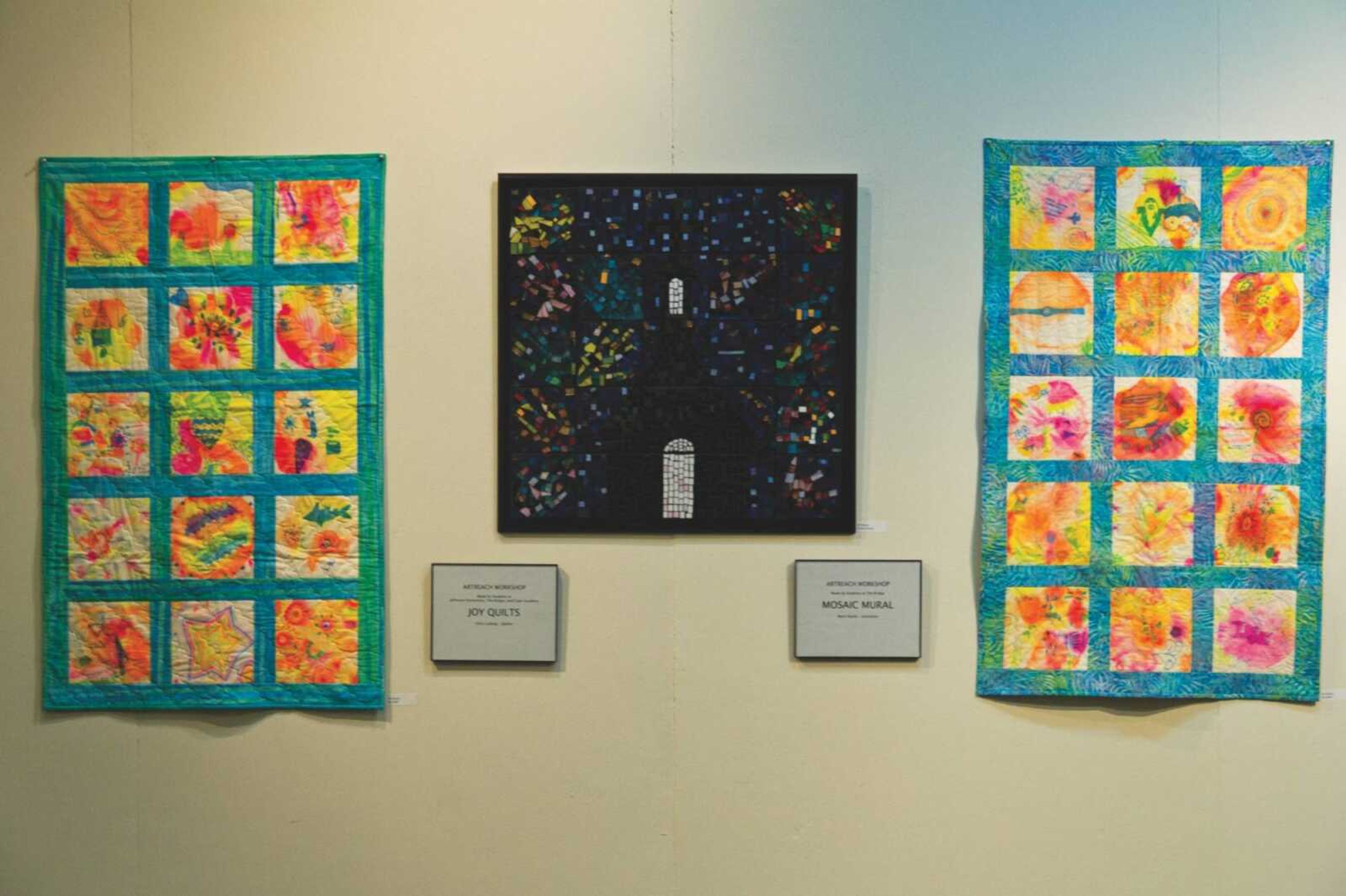 Collaborative quilts and a mosaic piece were created by "ArtReach!" students.