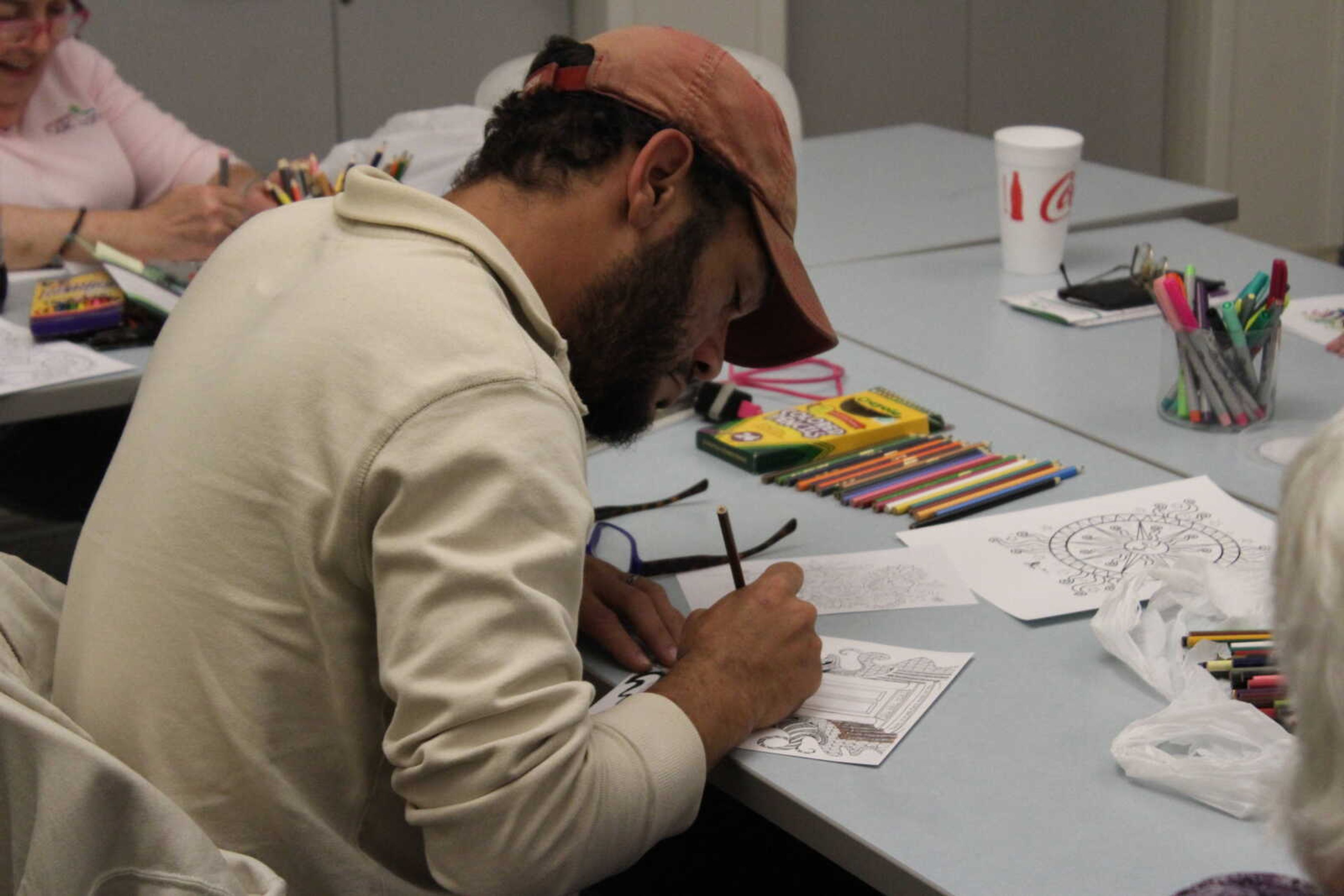 Steven Dusterhoft expresses himself through design at Cape Girardeau Public Library’s “Coloring for Adults” event on Oct. 24.