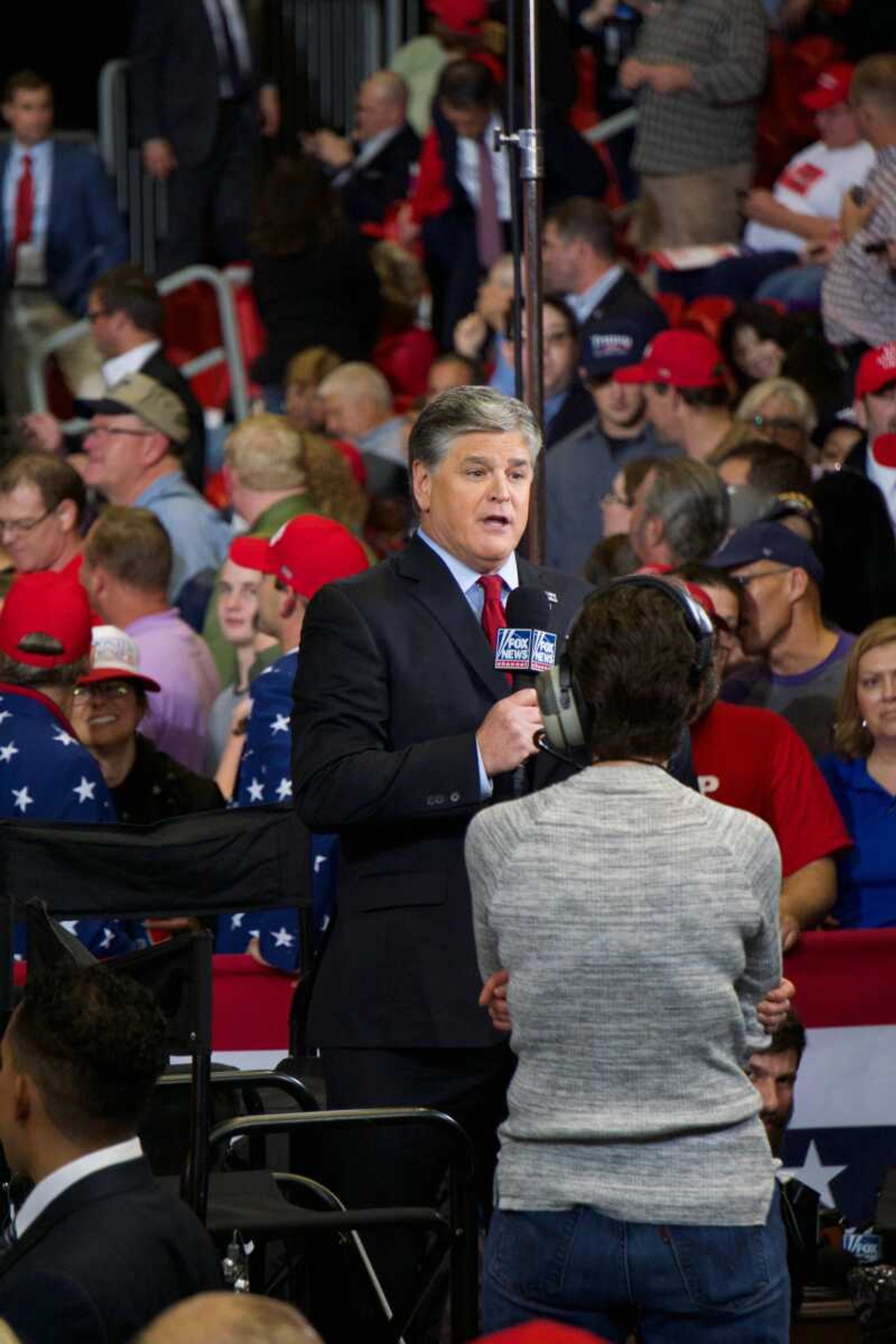 Conservative TV and radio personality Sean Hannity films his show near the edge of the crowd at President Trump's last MAGA rally of the Midterm Elections in Cape Girardeau Nov. 5.