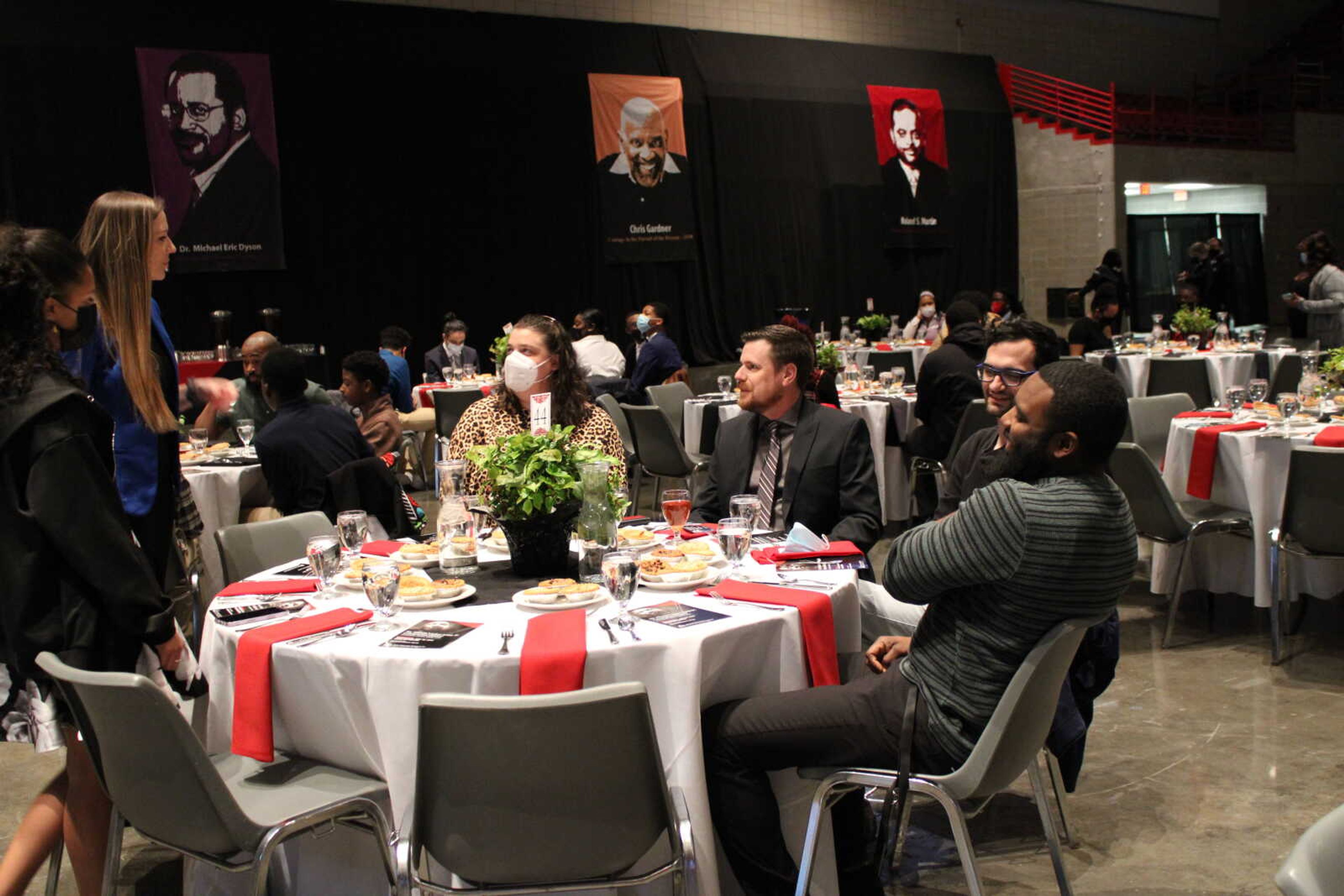 Audience members mingle before the start of the MLK celebration dinner on Jan. 26, 2022.