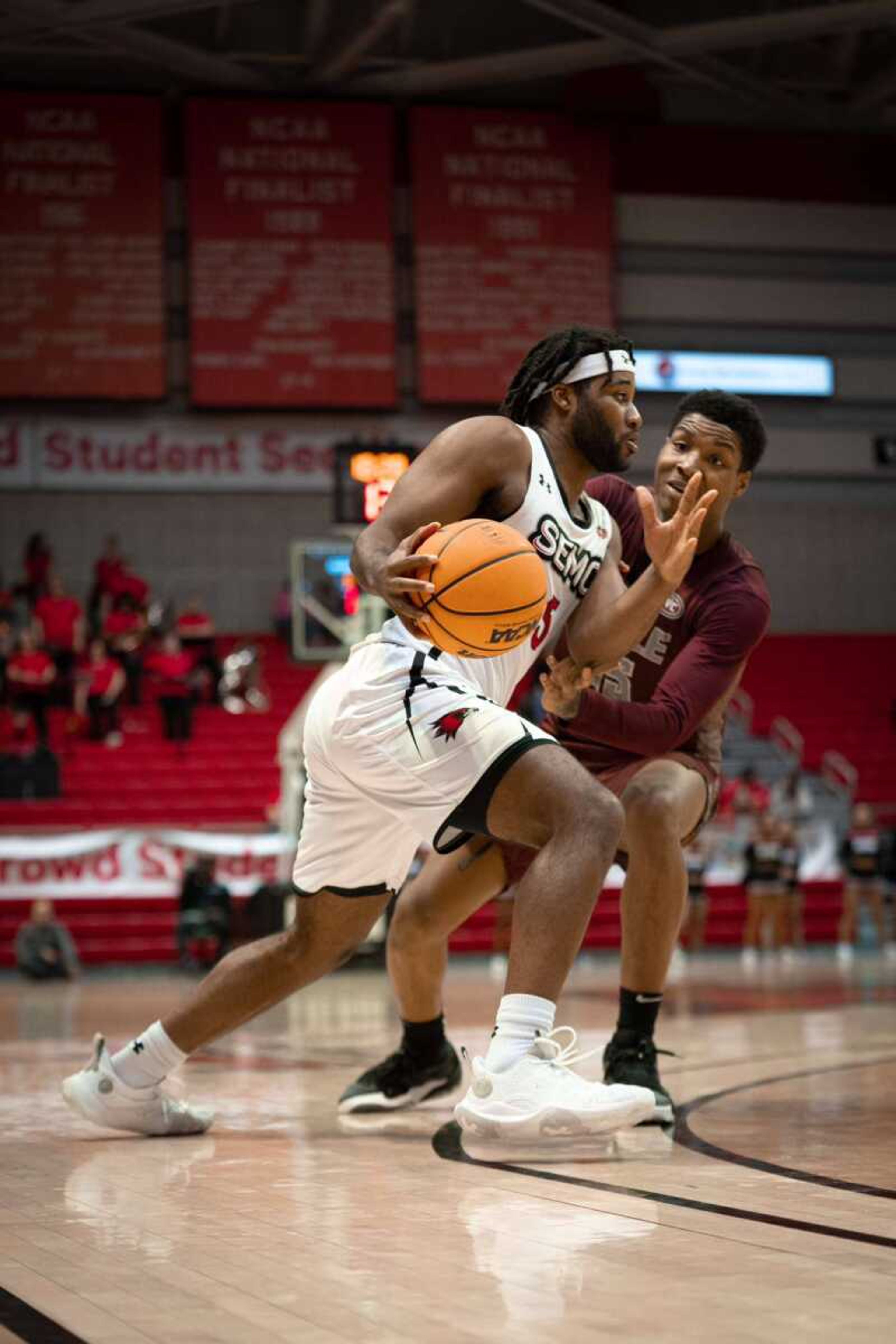 Senior guard Chris Harris (05) attempts to move past an Arkansas-Little Rock player. Harris has been a starting player in 21 games this season for the men's basketball team.