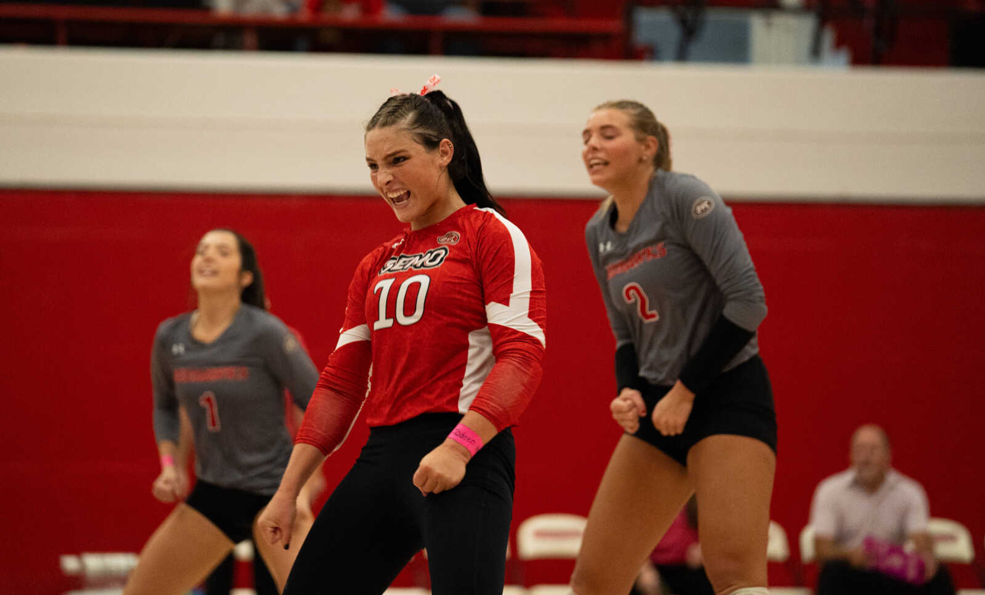 SEMO graduate student libero Tara Beilsmith (10)celebrates a big play with freshmen libero Nina Schuberth and outside hitter Lucy Ardnt on the during SEMO match against UT-Martin on Oct. 6 at Houck Field House. The Redhawks would sweep UT-Martin in three straight sets.