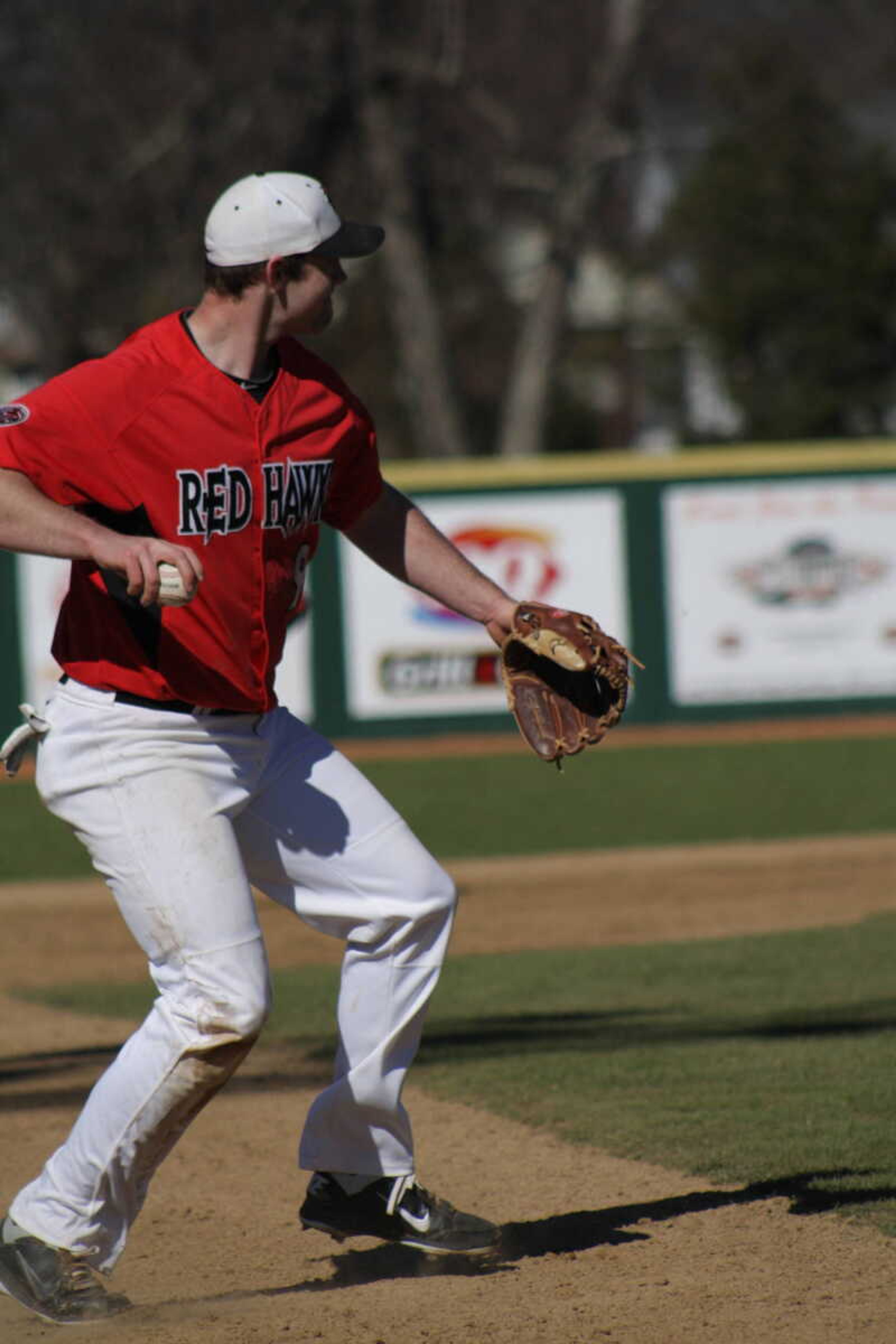 Trenton Moses throws the baseball to Southeast's first baseman during a 
game on Feb. 25. - Photo by Nathan Hamilton