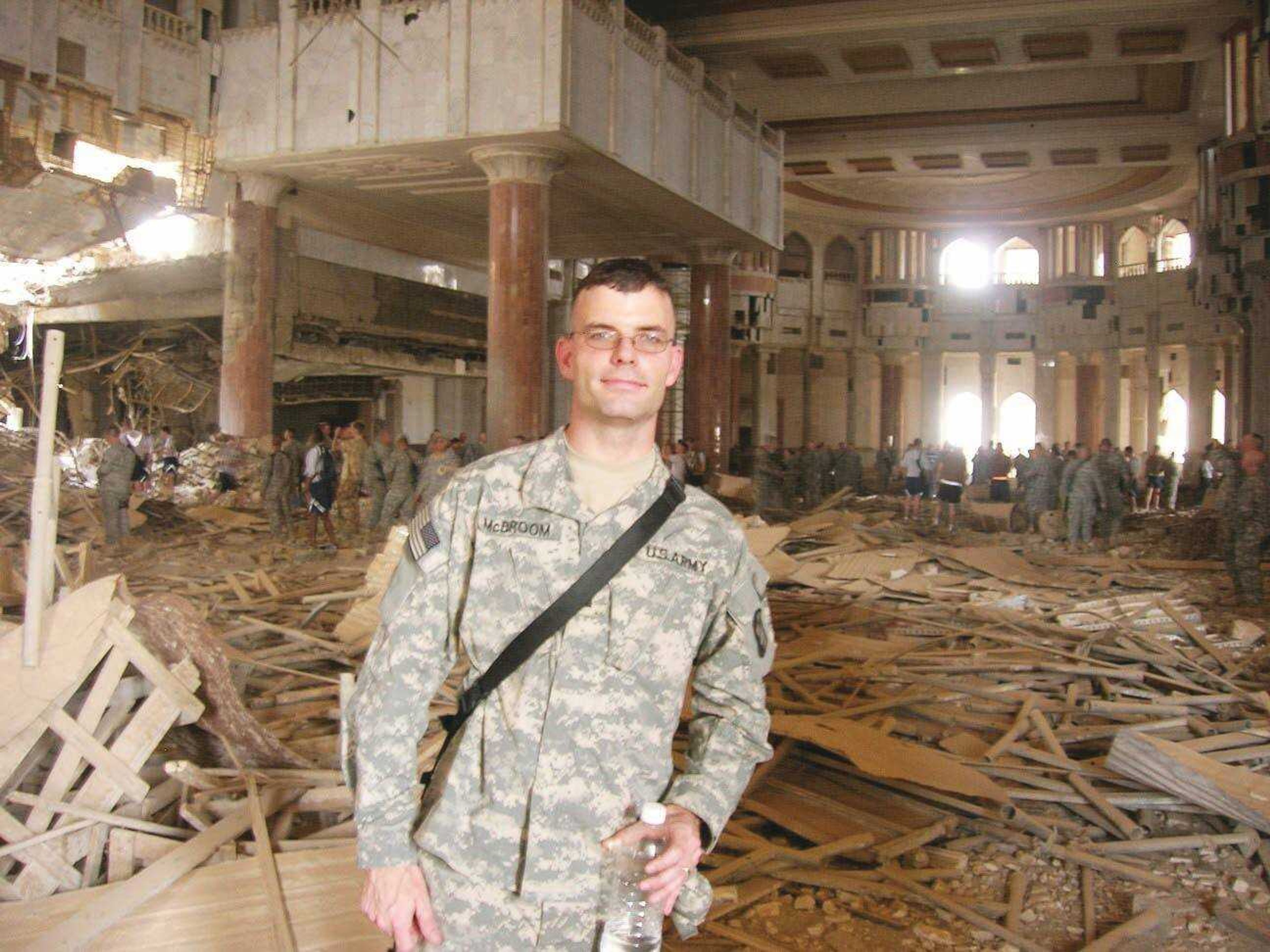 <b> Jeremy McBroom stands in Saddam's Palace in Iraq. </b> Submitted photo
