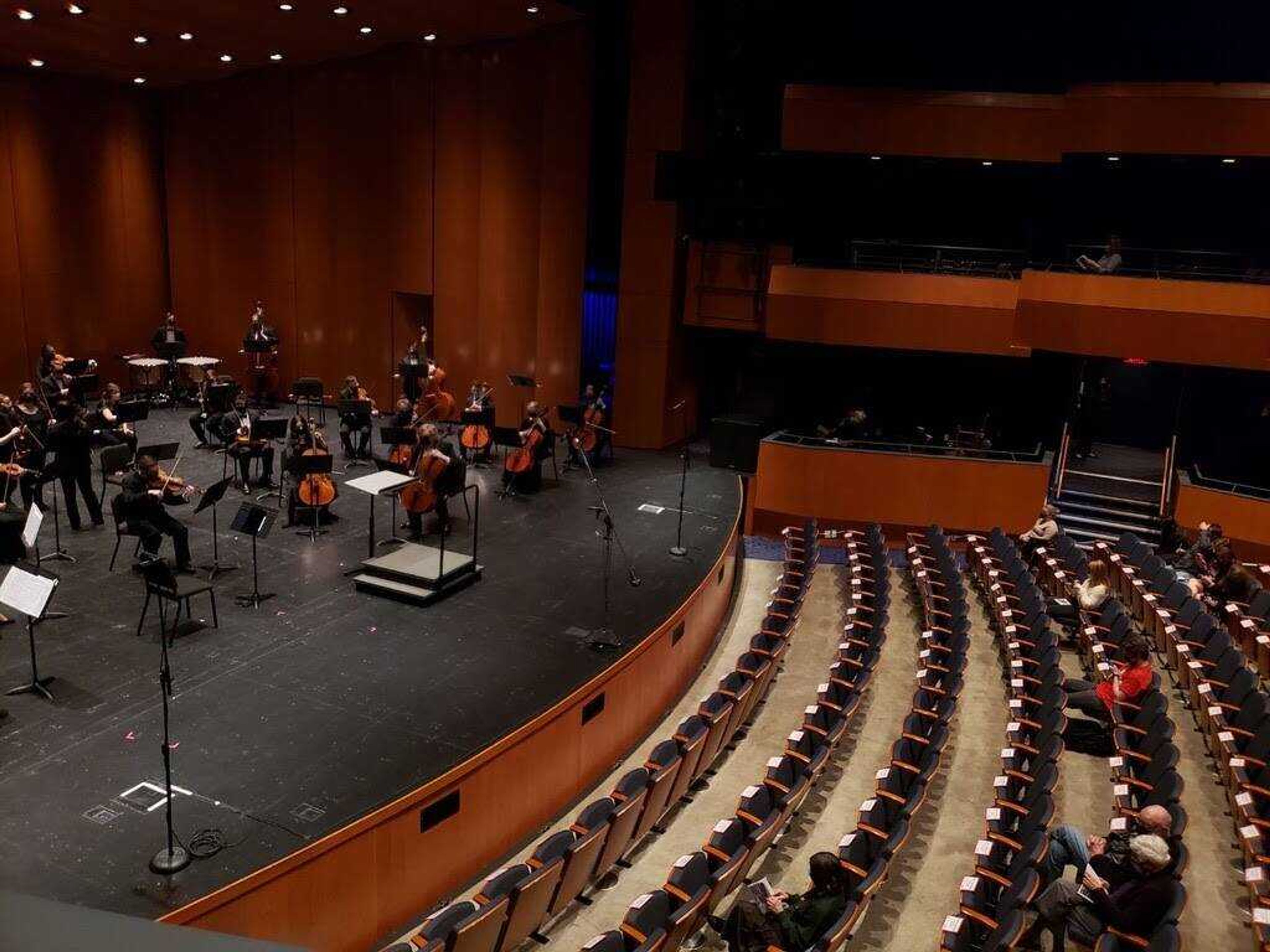 Balcony view of the Southeast Missouri Symphony Orchestra. Before the show started, performers tuned their instruments to get ready.