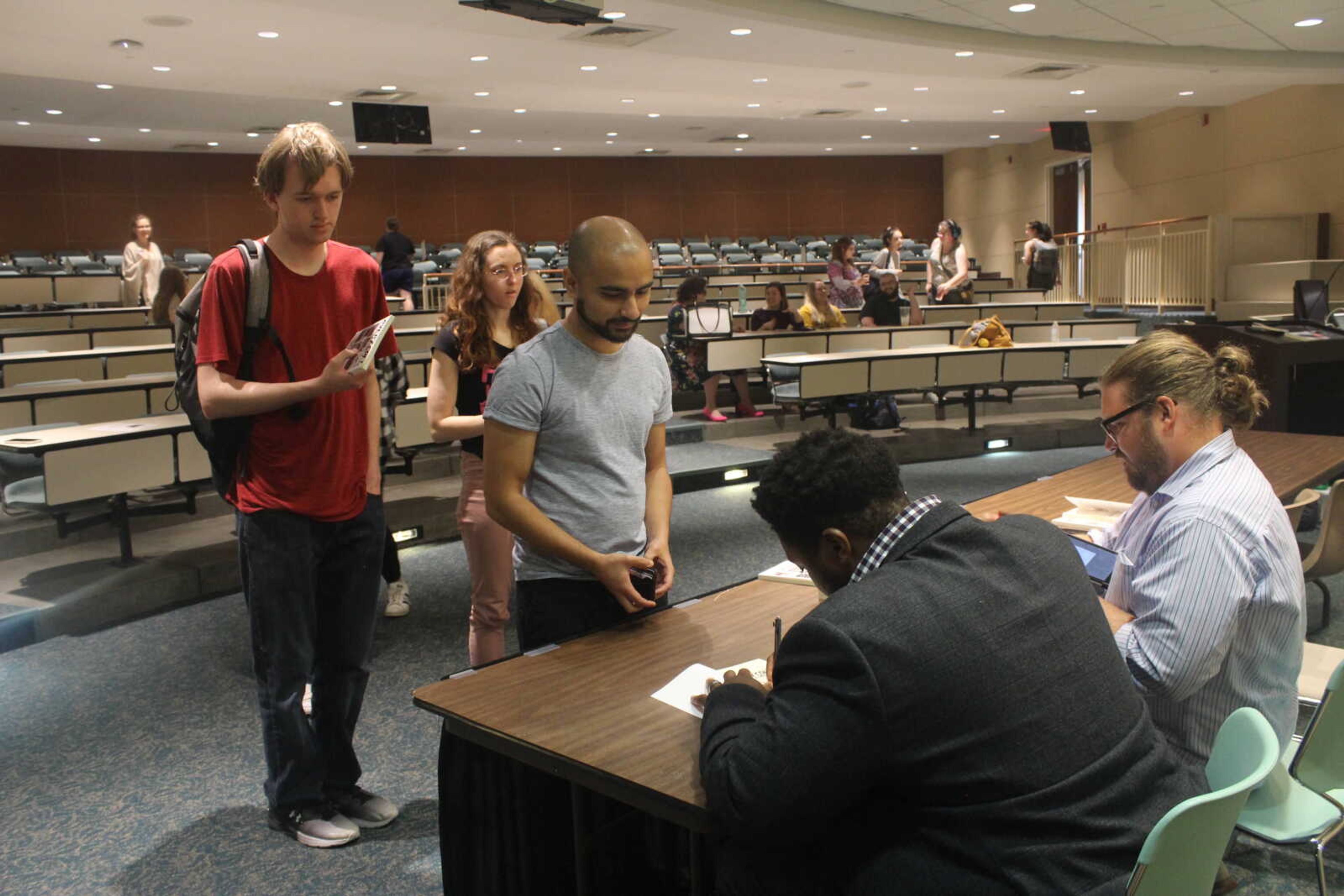 Author Ron Austin meeting and signing his book for Southeast students after his reading. 