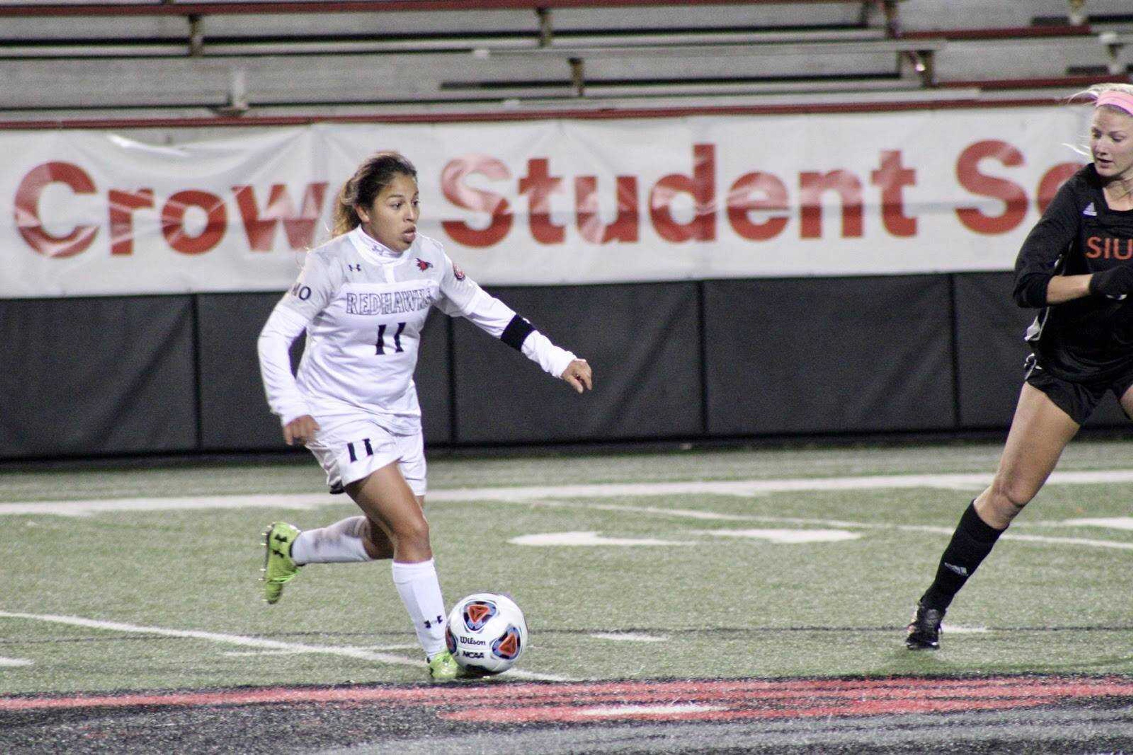 Senior midfielder Esmie Gonzales carries the ball near the middle of the field against SIUE on Nov. 8 at Houck Field.