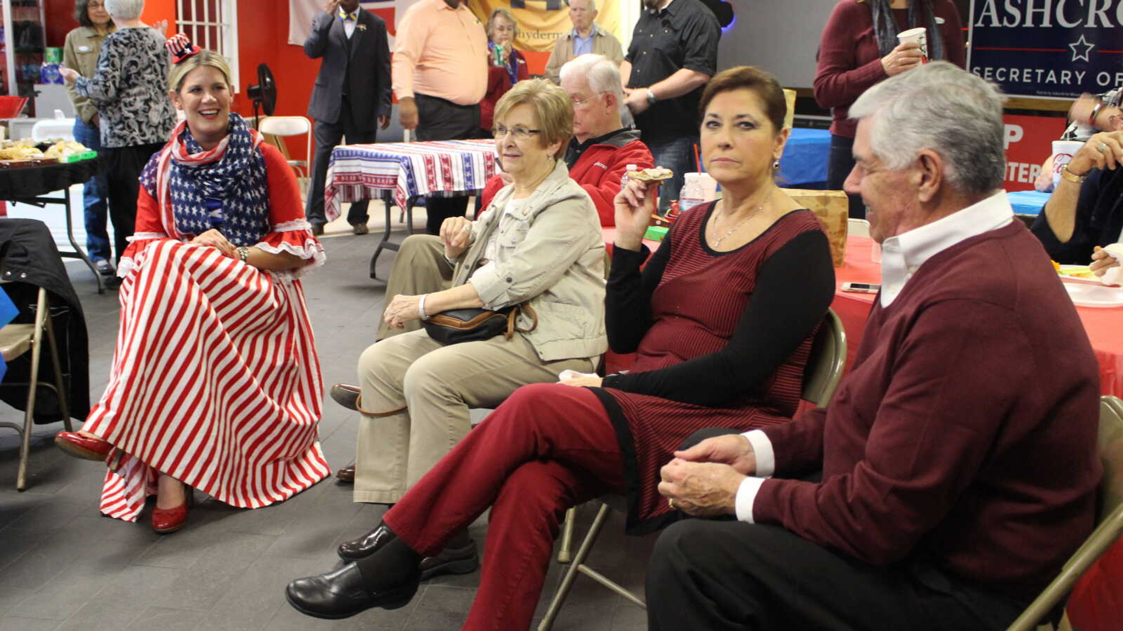 Participants of the Cape County Republican watch party keep tabs on the polls.