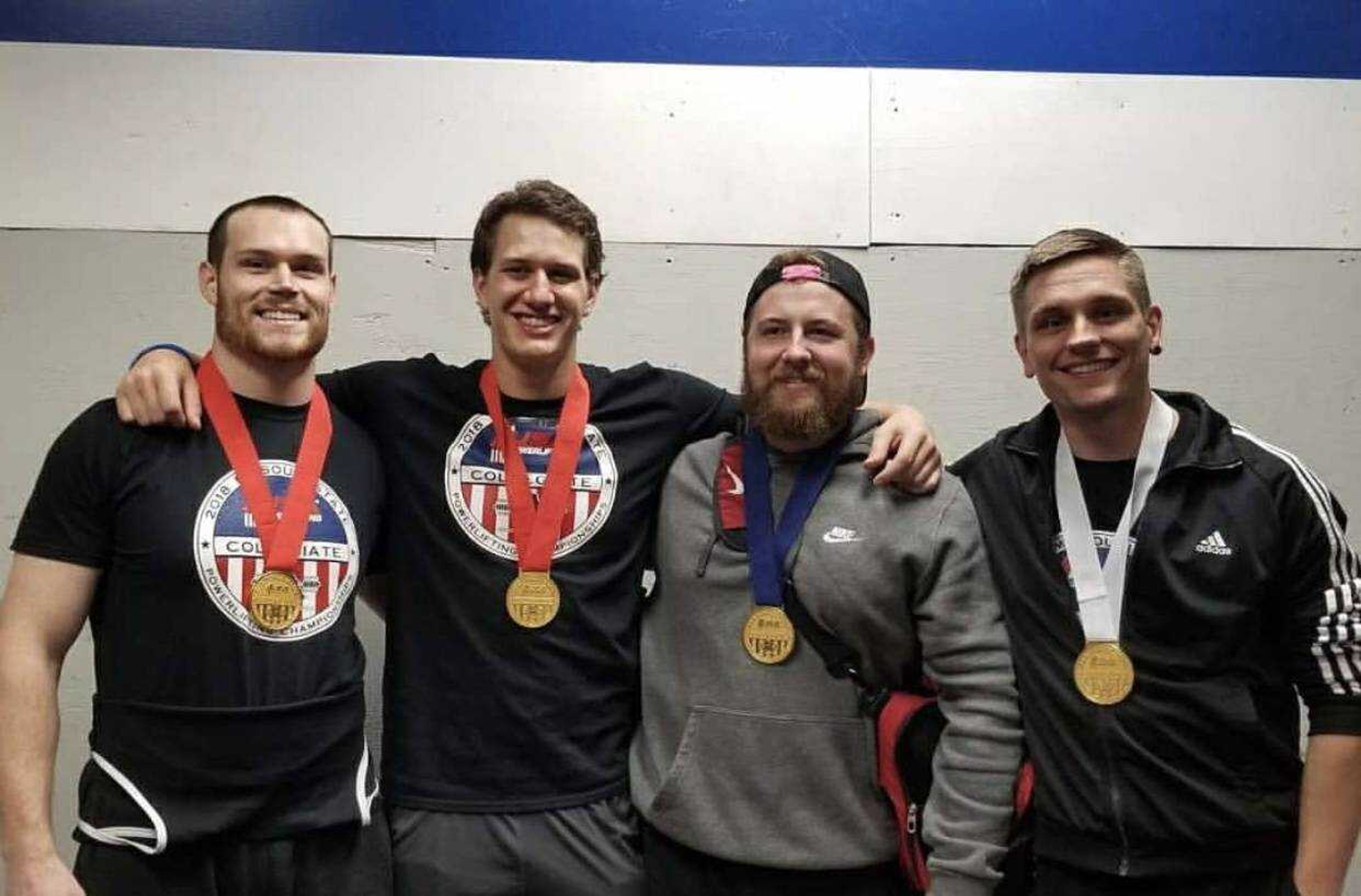 Southeast strength club posing with their medals after the Missouri Collegiate Powerlifting Champions in Columbia, MO in 2018. 
(Left to right: Ed Meixner, Kurt Holderle, Seth Sievers, Patryk Piekarczyk)