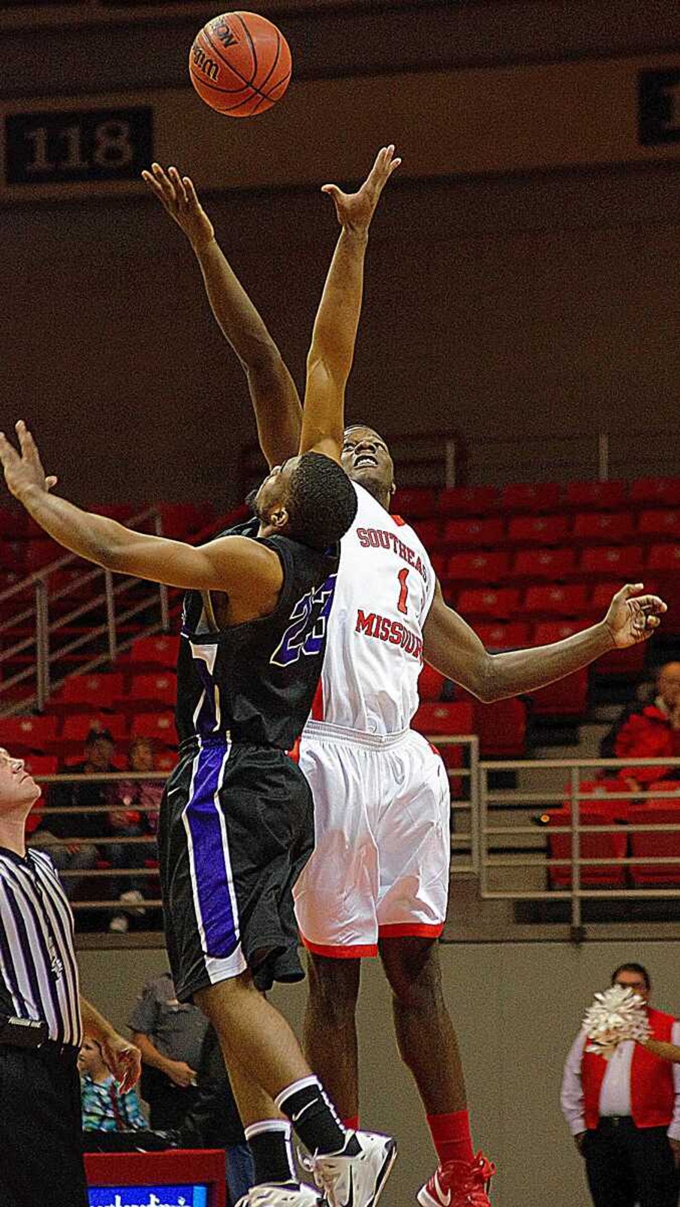 Southeast forward Nino Johnson competes for the jump ball at the start of the game against Ouachita Baptist on Oct. 30 at the Show Me Center. Photo by Nathan Hamilton.