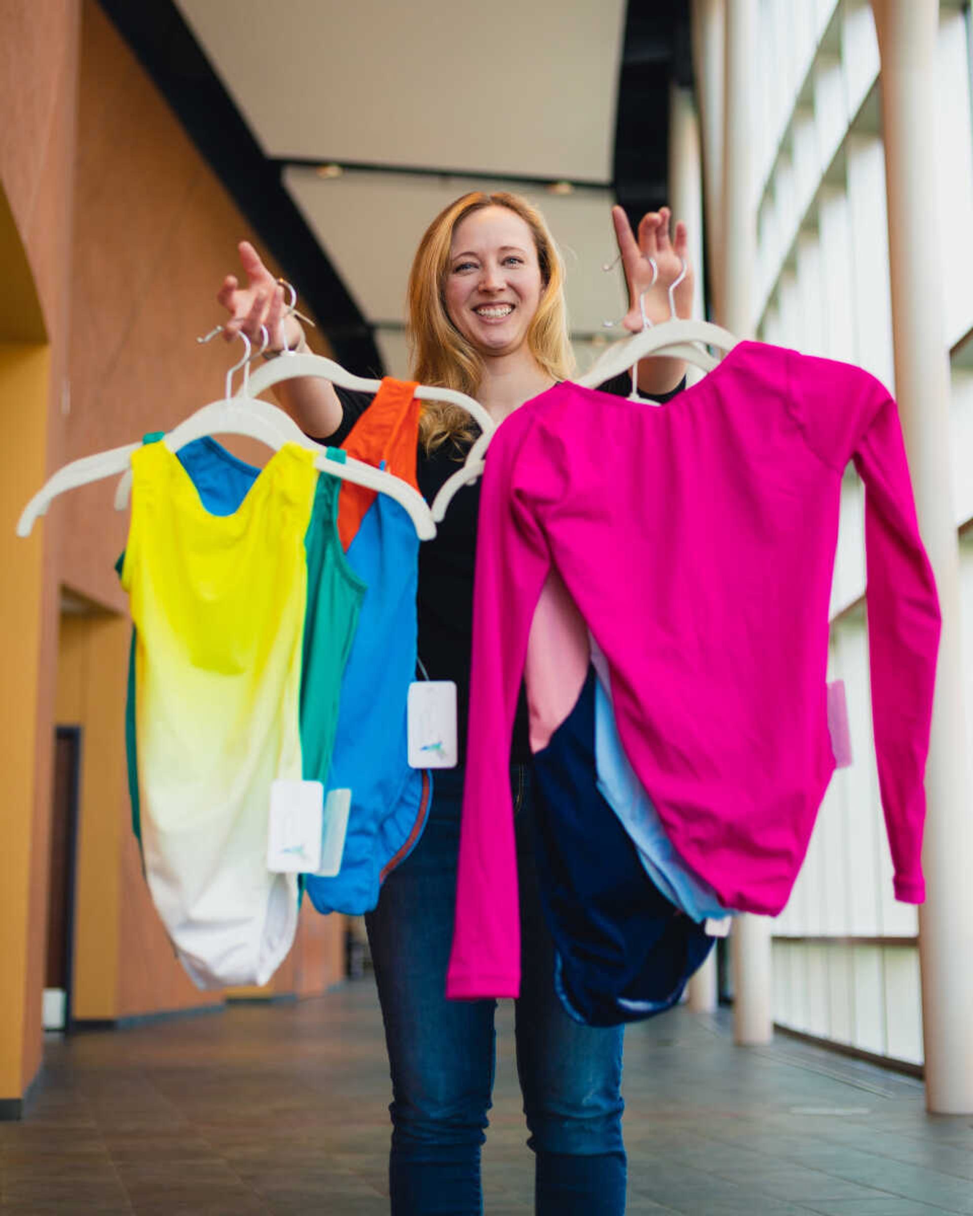 Southeast dance instructor Alyssa Alger holds up several of her handmade leotards Thursday, March, 21 at the River Campus.