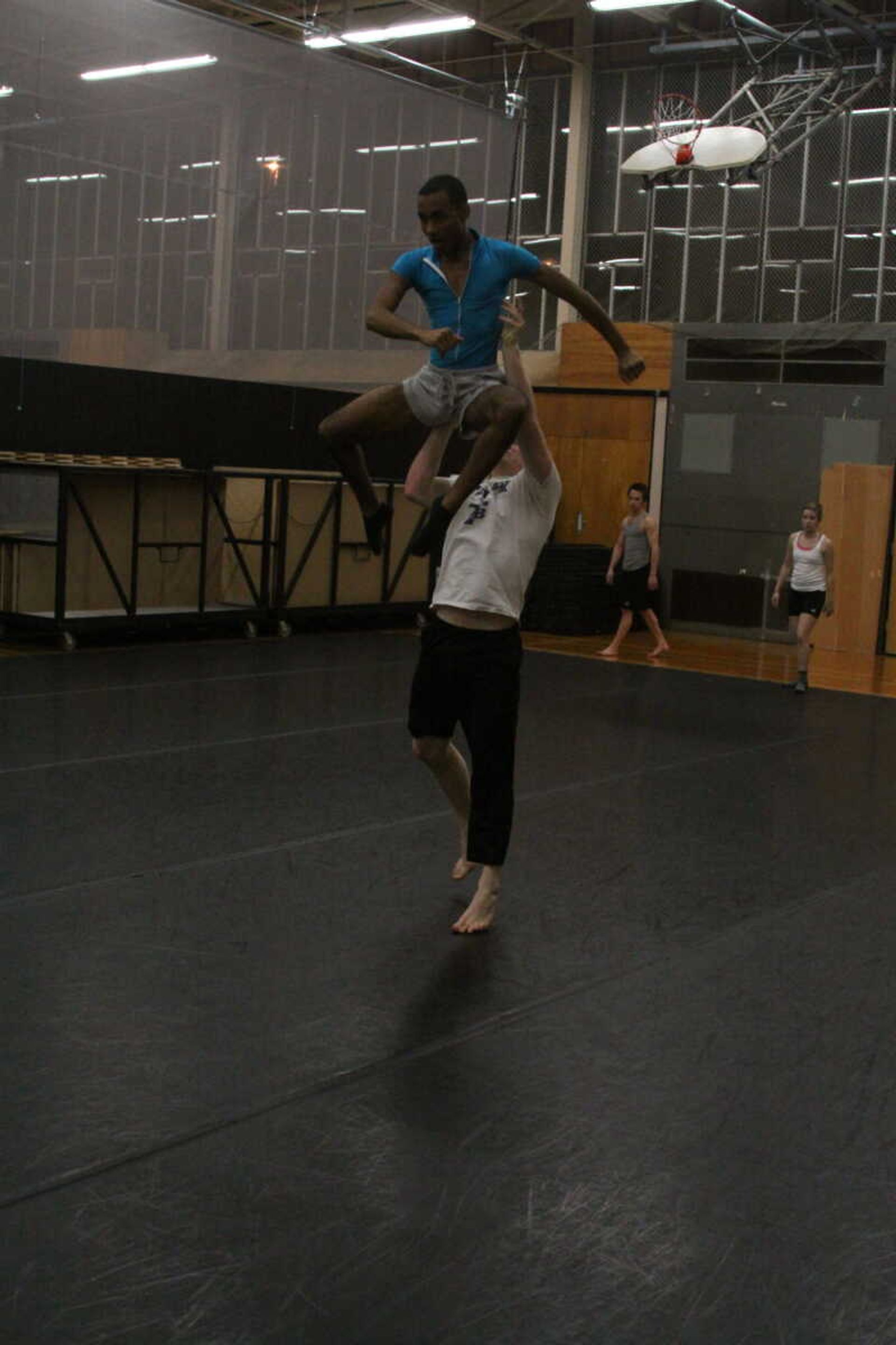 Thomas Proctor lifts Chance Hill in a battle scene in "After the Sky Opened." - Photo by Kelso Hope