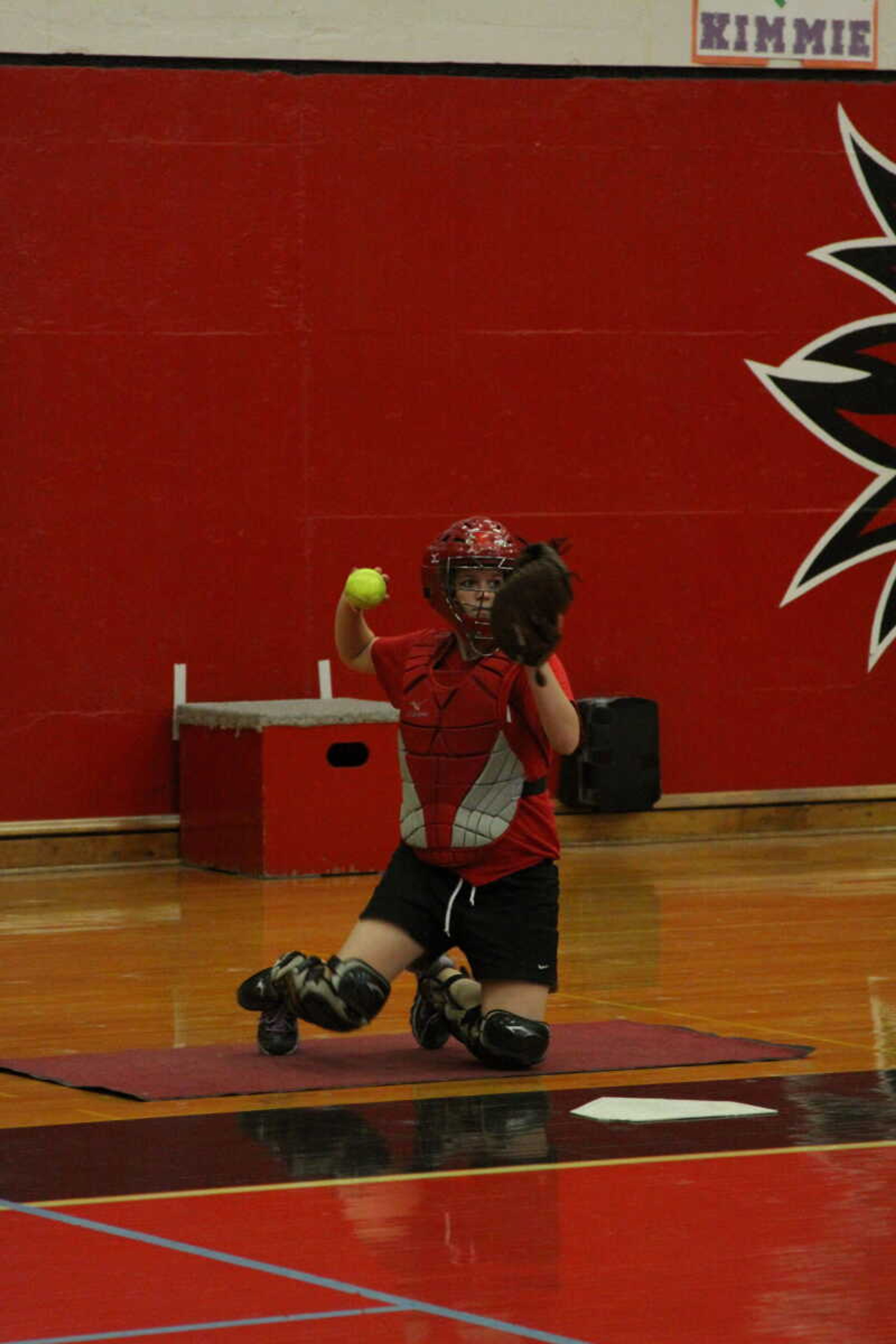 Southeast freshman catcher Jamie Woodworth practices with the 
pitchers on Wednesday at Houck Field House. - Photo by Kelso Hope