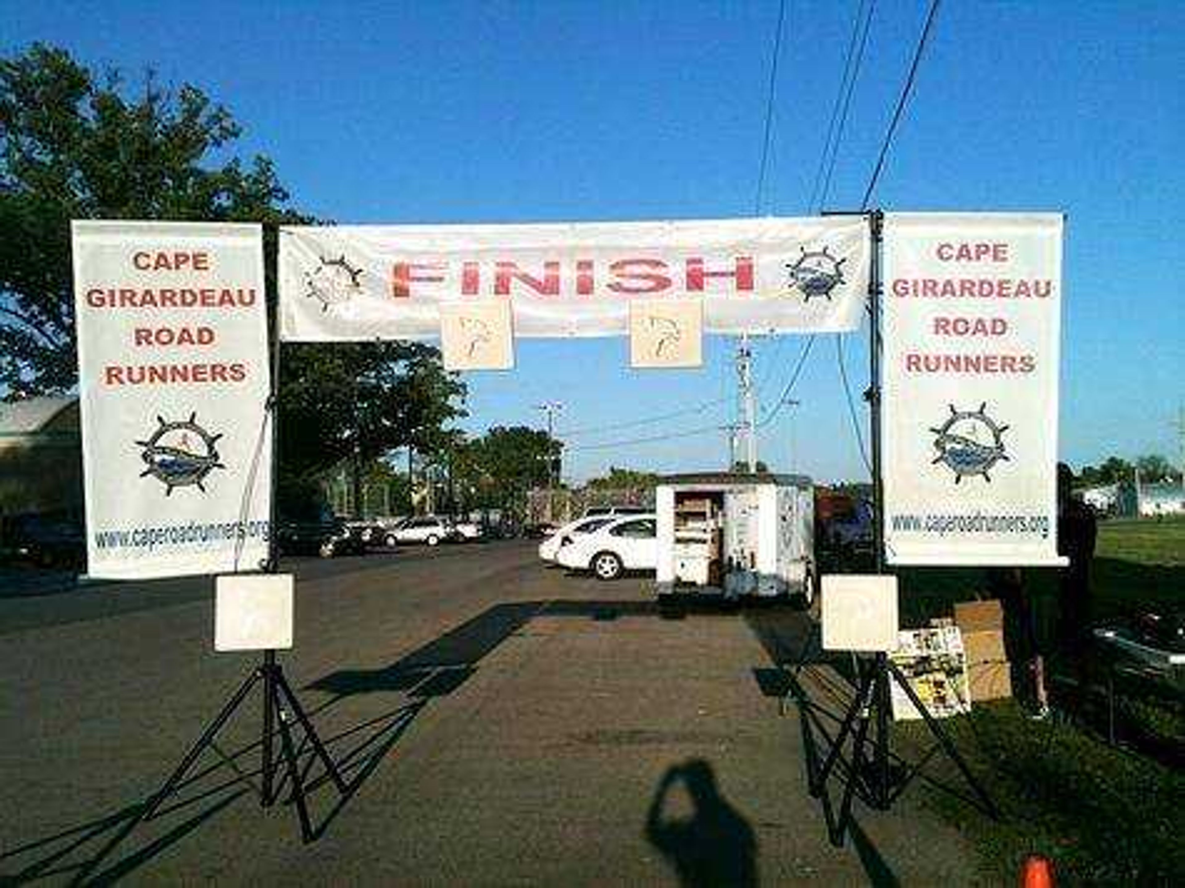 Cape Road Runners set up the finish line before a race. Submitted photo