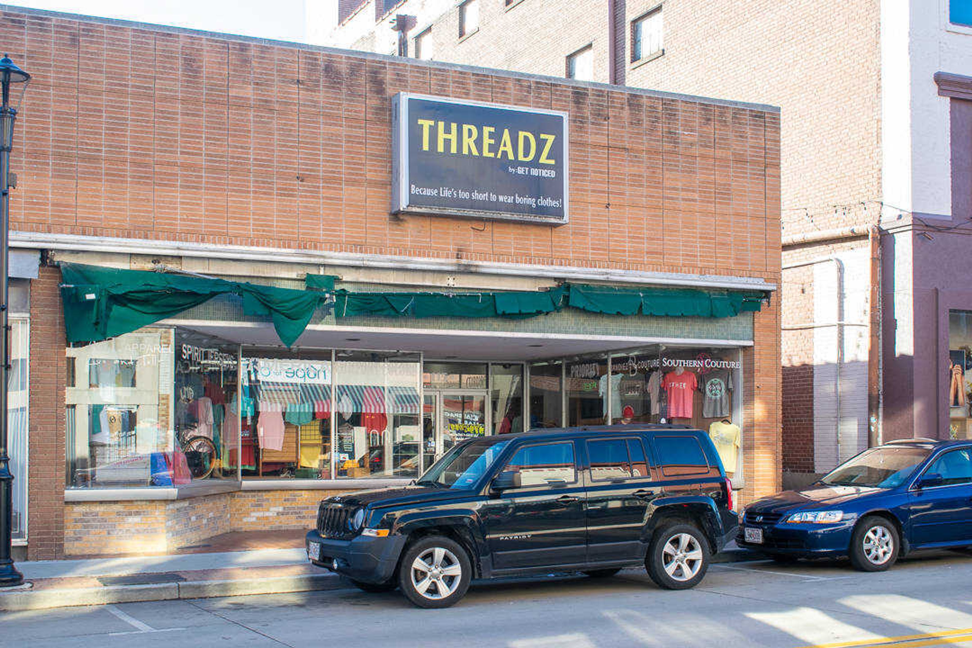 The storefront of local business Threadz is displayed on Main Street in Cape Girardeau on Monday, Sept. 23.