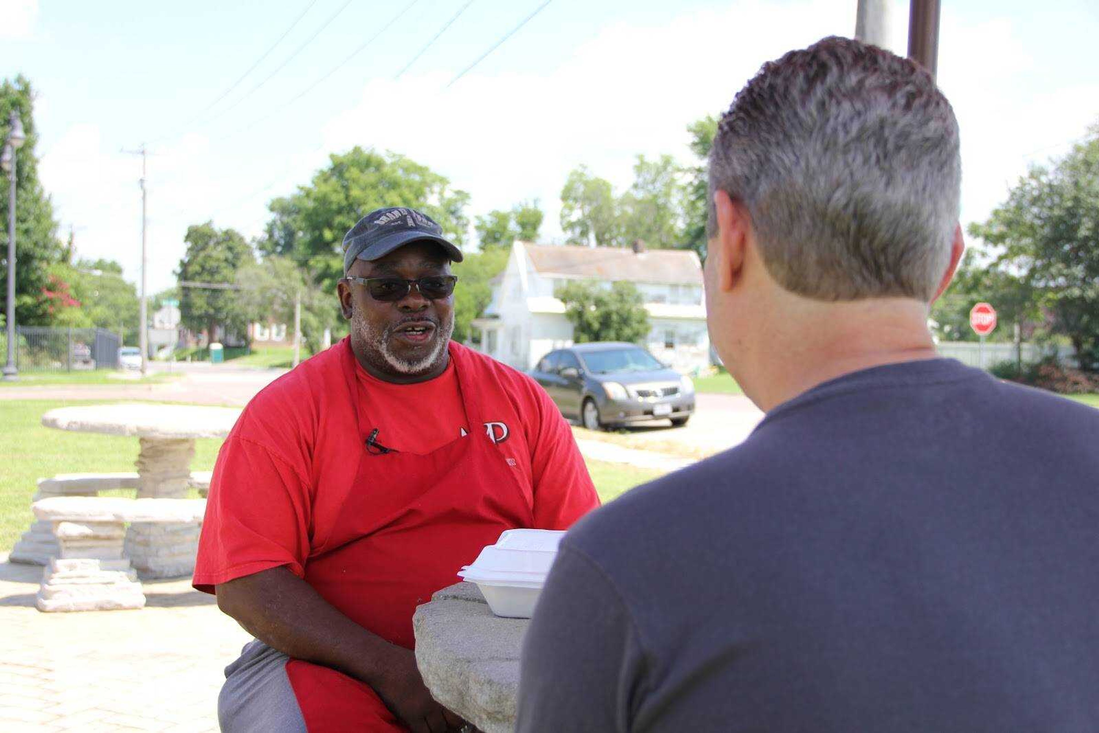 Founder of the Humans of Cape project, Chris Edmond, interviewing a member of the Cape Girardeau community. 