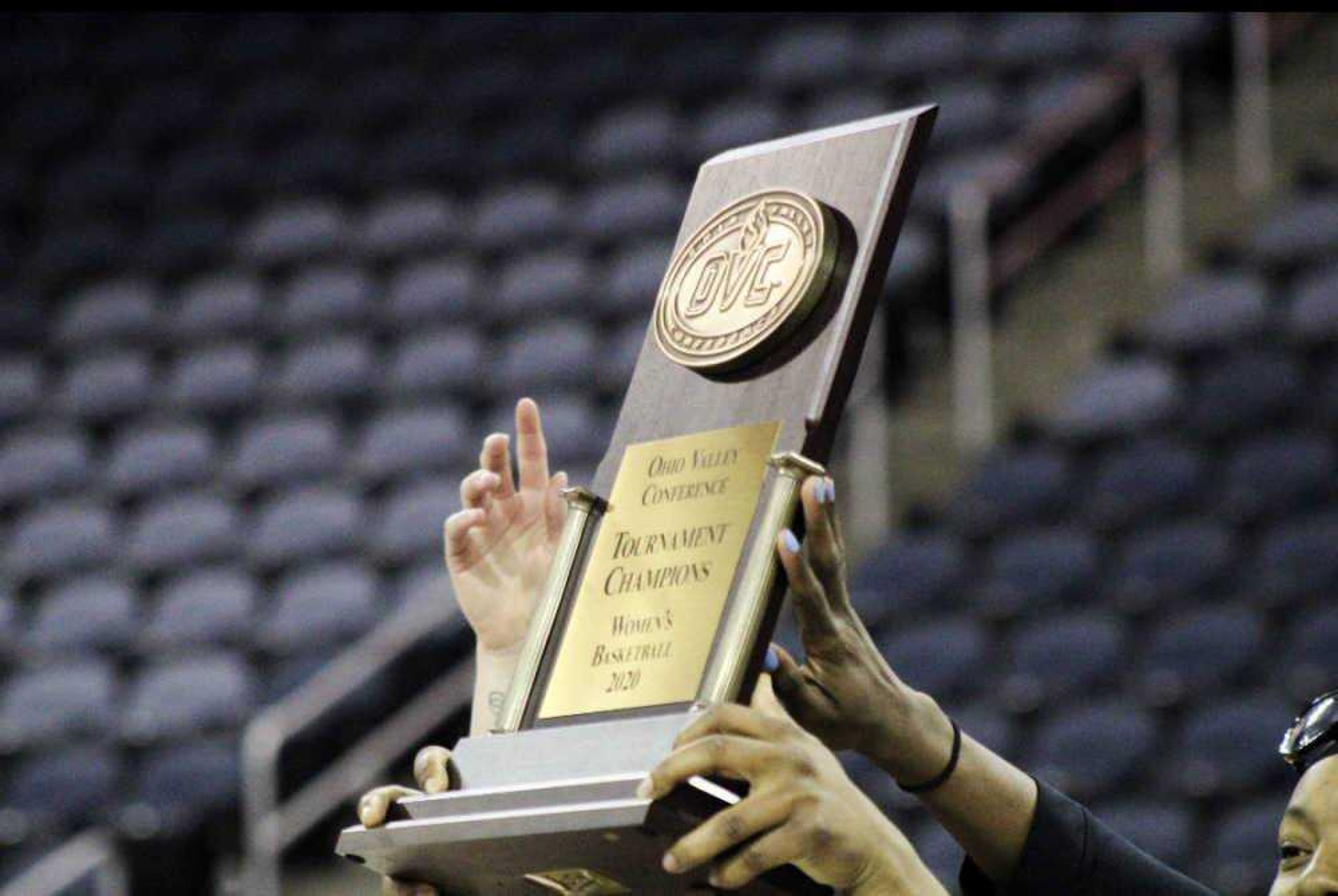 The Southeast women’s basketball team hoisting the OVC Tournament championship trophy on March 7.