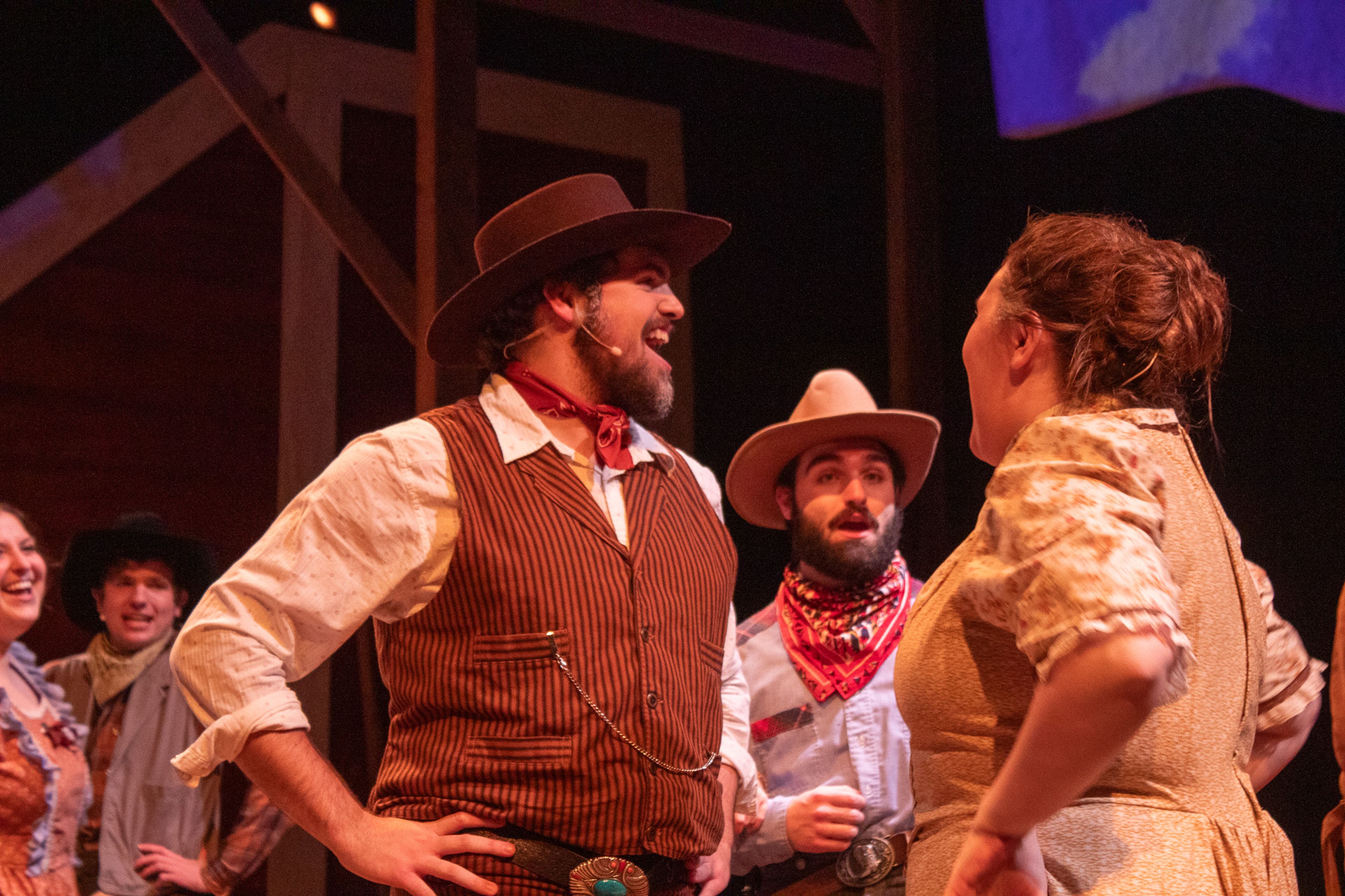 Andrew, played by Andrew Hnad, and Aunt Eller, played by Grace Fisher, sing about Oklahoma and how it will become a new state.