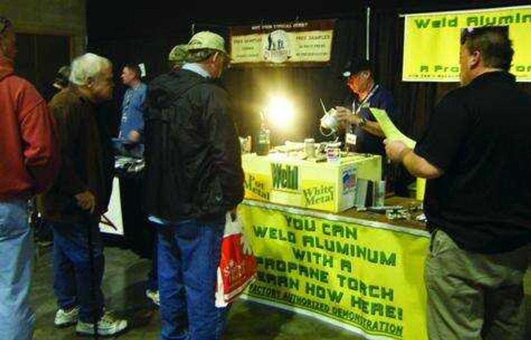 People gather around a vendor at the Great Outdoors Sports Show last year. Submitted photo