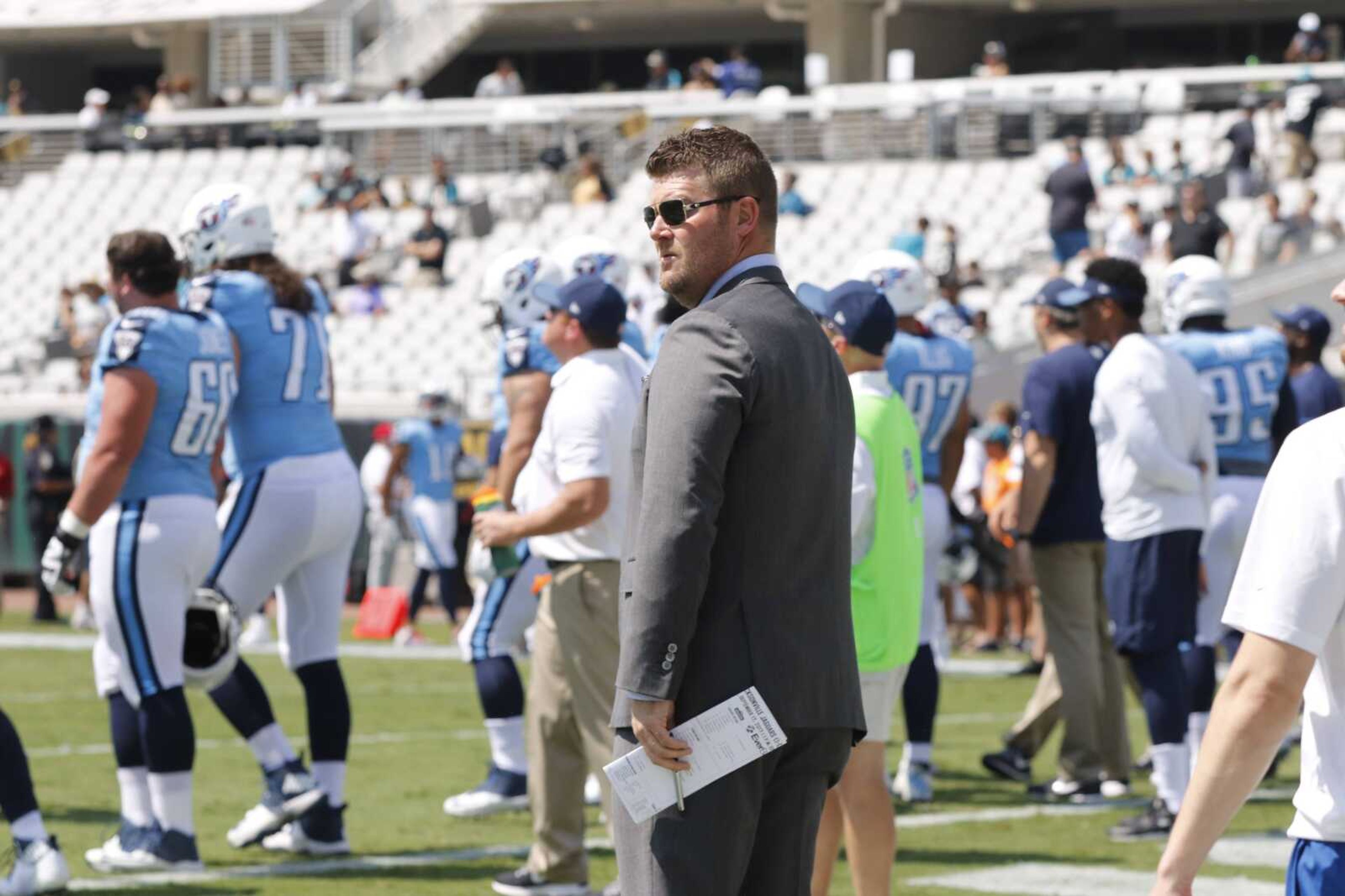 Jon Robinson stands on the sideline before a Tennessee Titans game.
