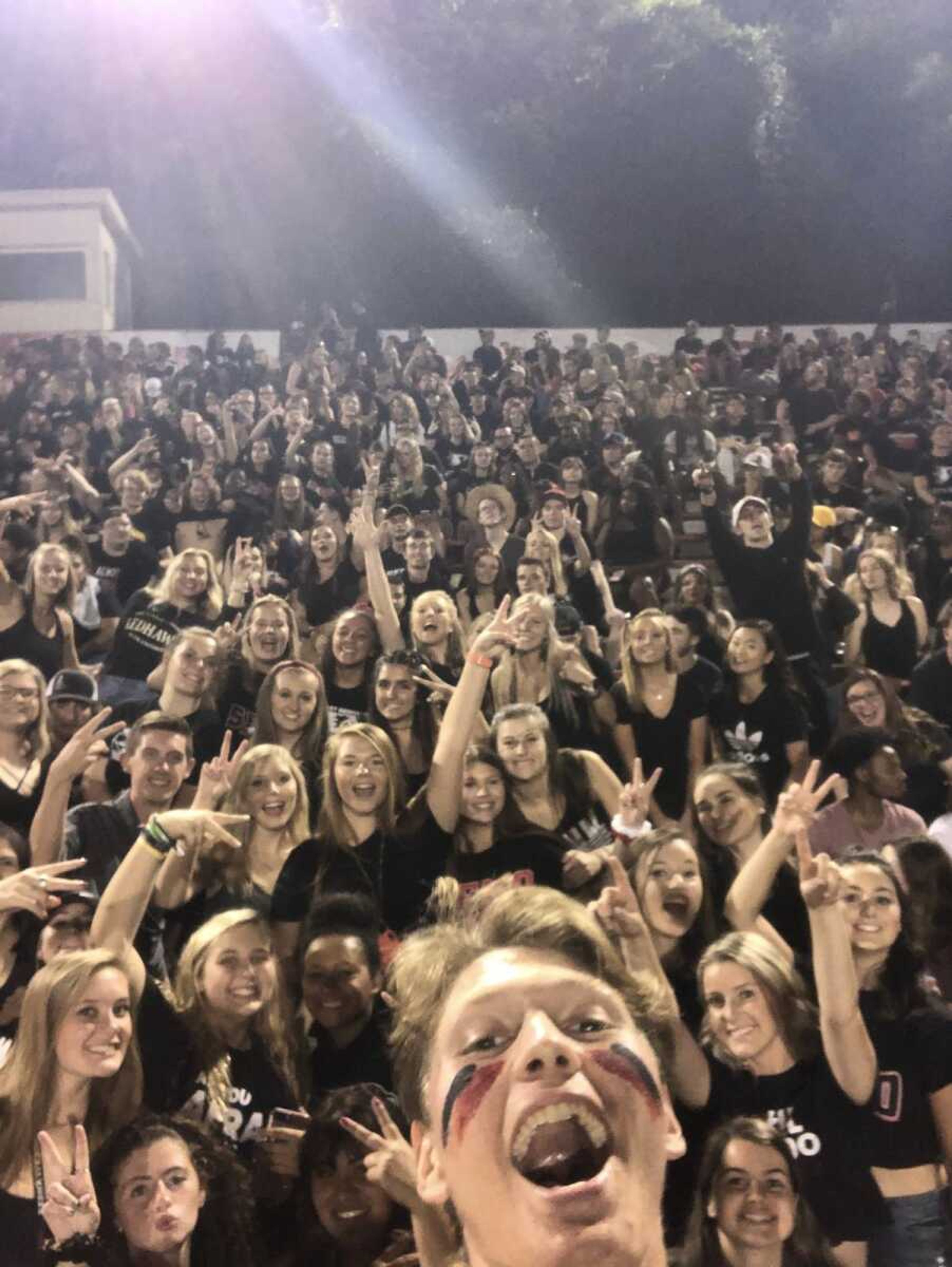 Freshman Aidan Gremminger (Bottom middle) takes a selfie with the Rowdy Crowd at football's home opener on Aug. 29 at Houck Stadium.
