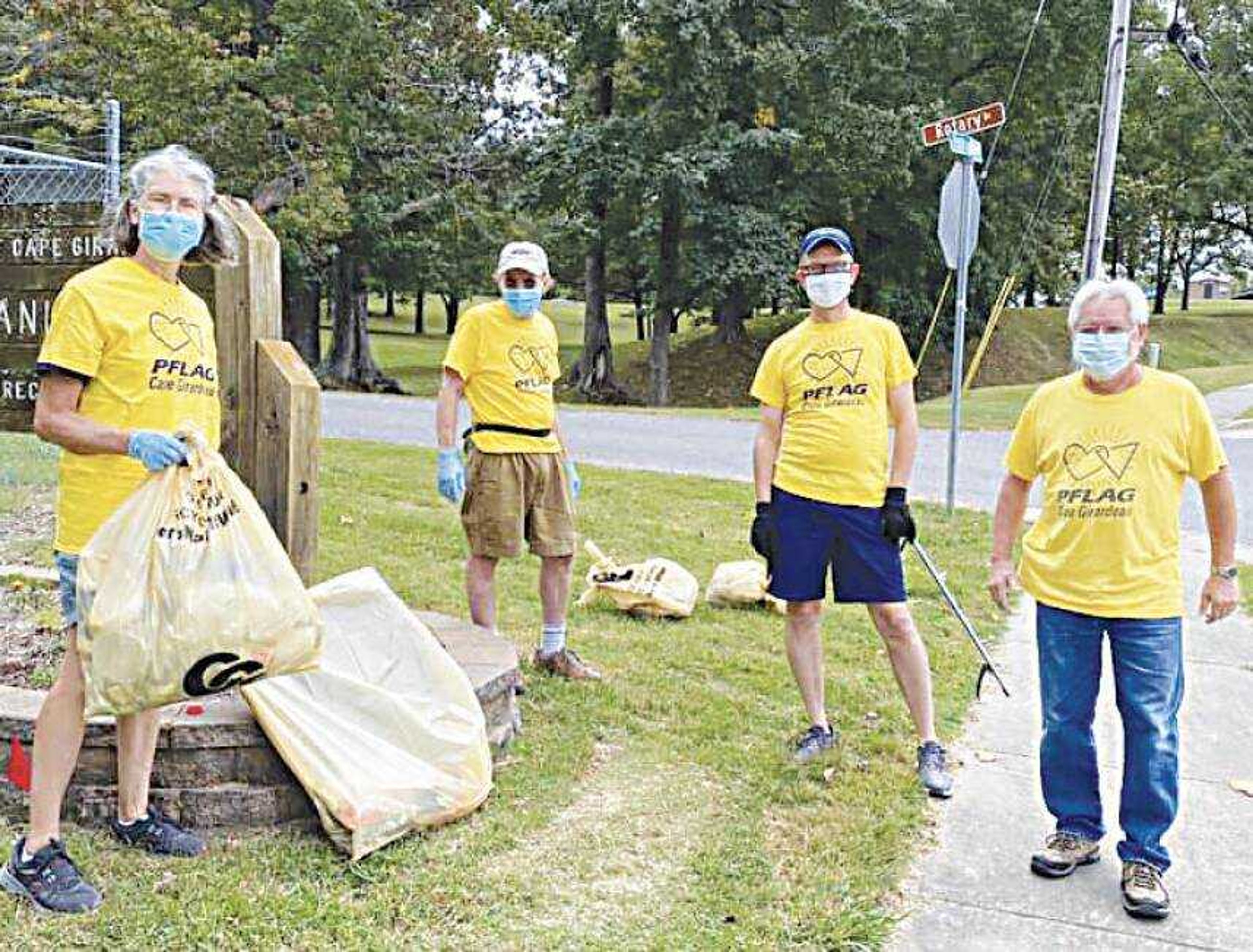 PFLAG members gather during a monthly trash pickup. From left to right, PFLAG board member Mary Maginel, president Jim Maginel, board member Kevin Hampton and board member Jim Dale.