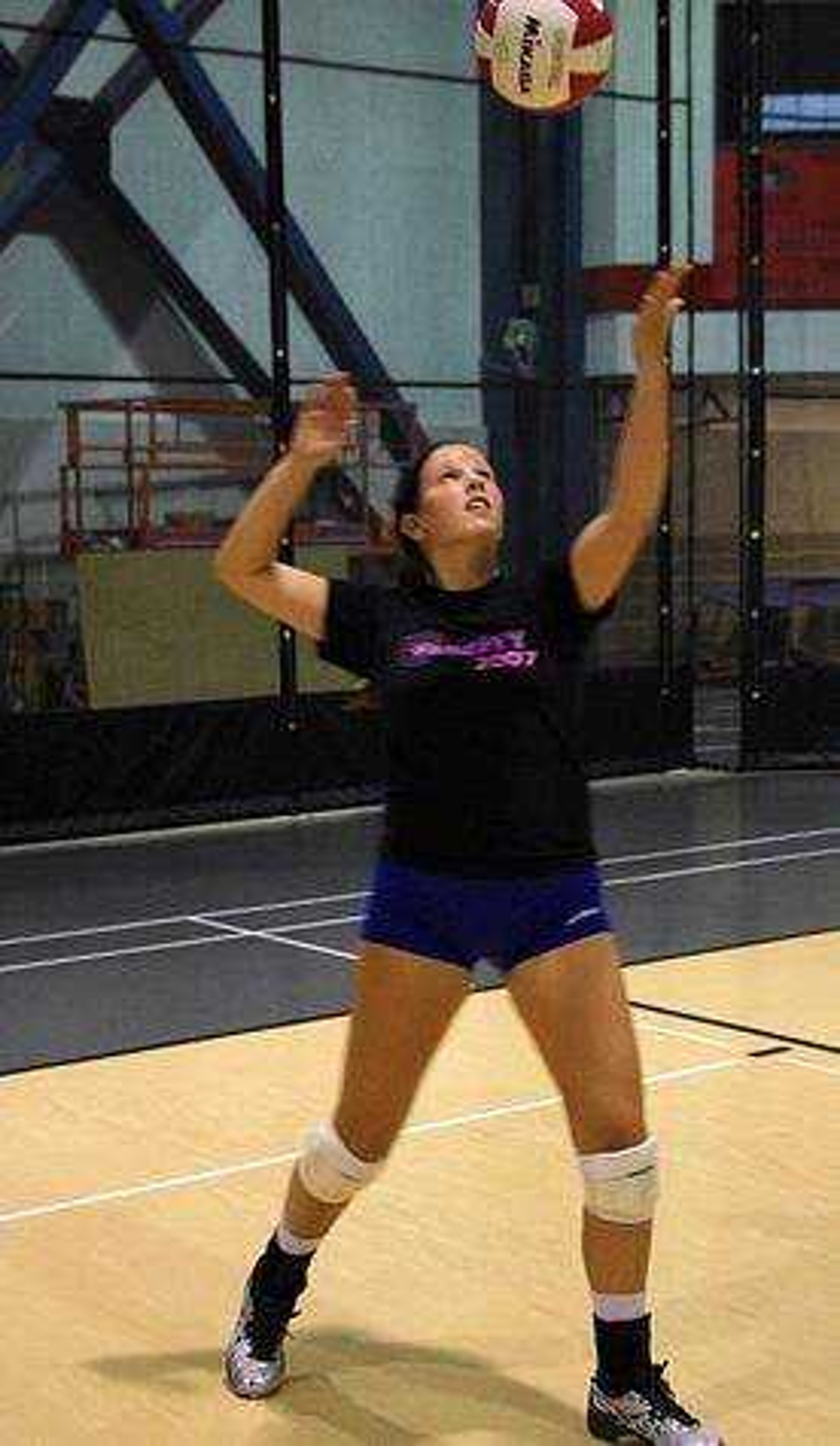 Kristen Stermon serves the ball at practice Tuesday Aug. 28 at Student Recreation Center-North. Photo by Nathan Hamilton