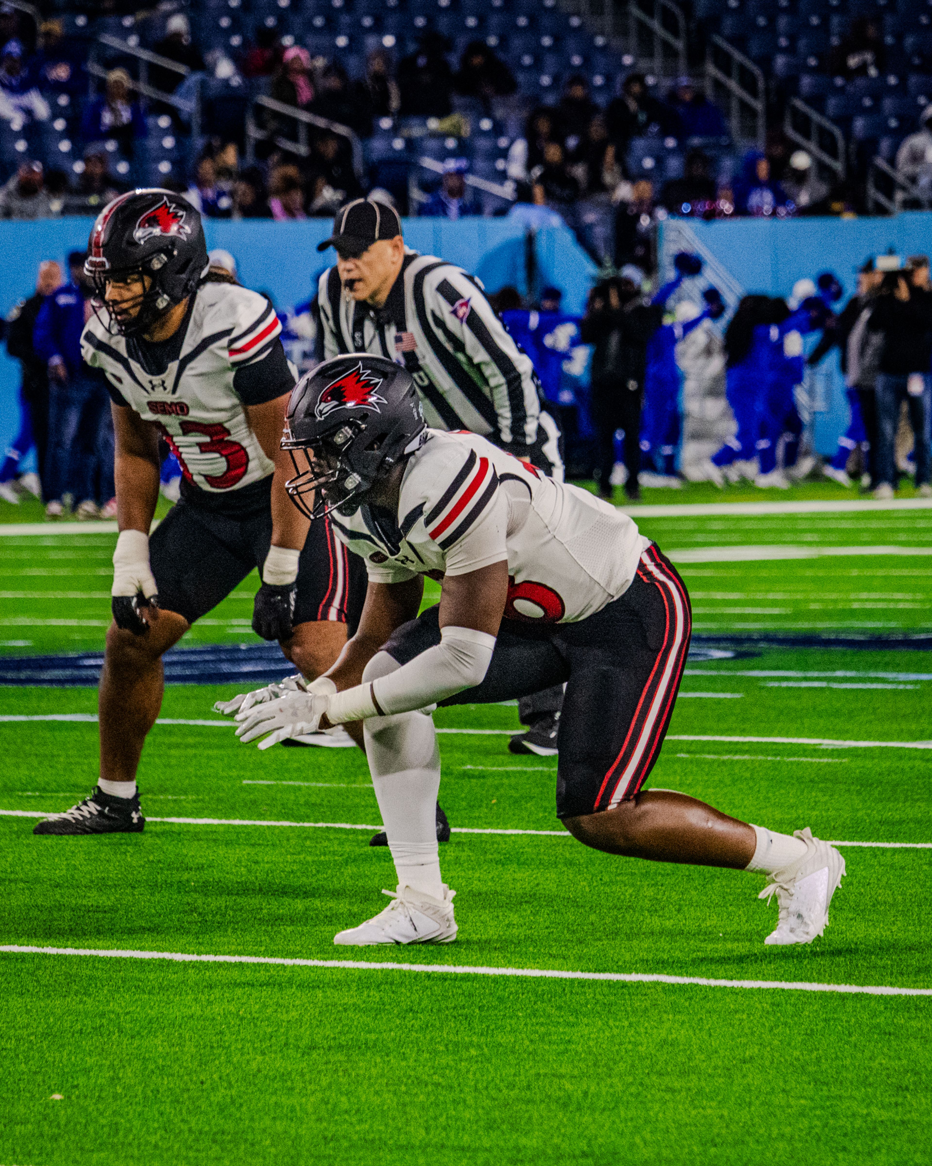 Junior defensive lineman Nasim Cairo and senior inside linebacker Mali Walton line up before the snap against TSU.