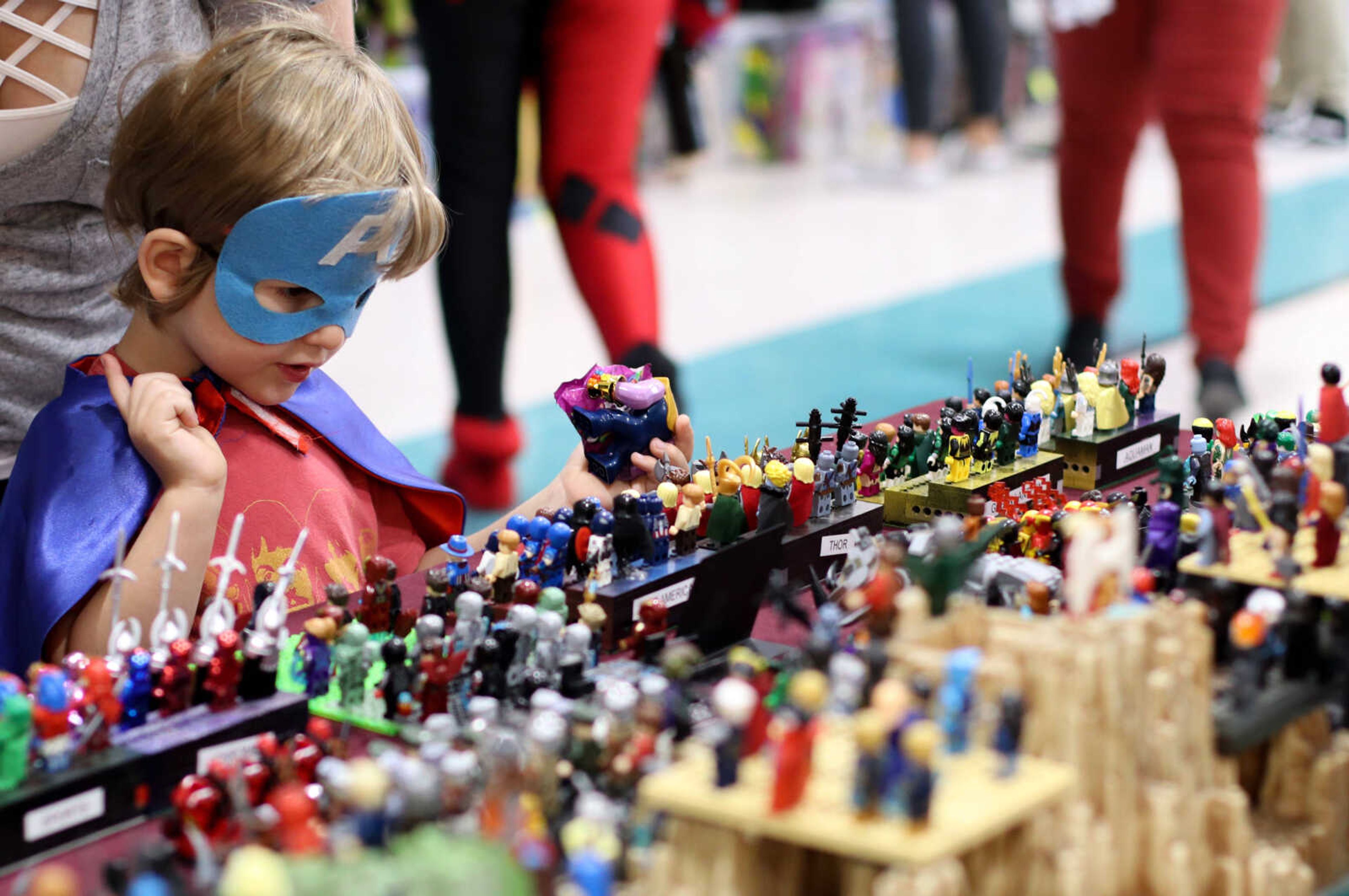 Benhett Powderly, 4, looks at the variety of Lego figures at Cape Comic Con held in the Osage Centre on Friday, April 26.