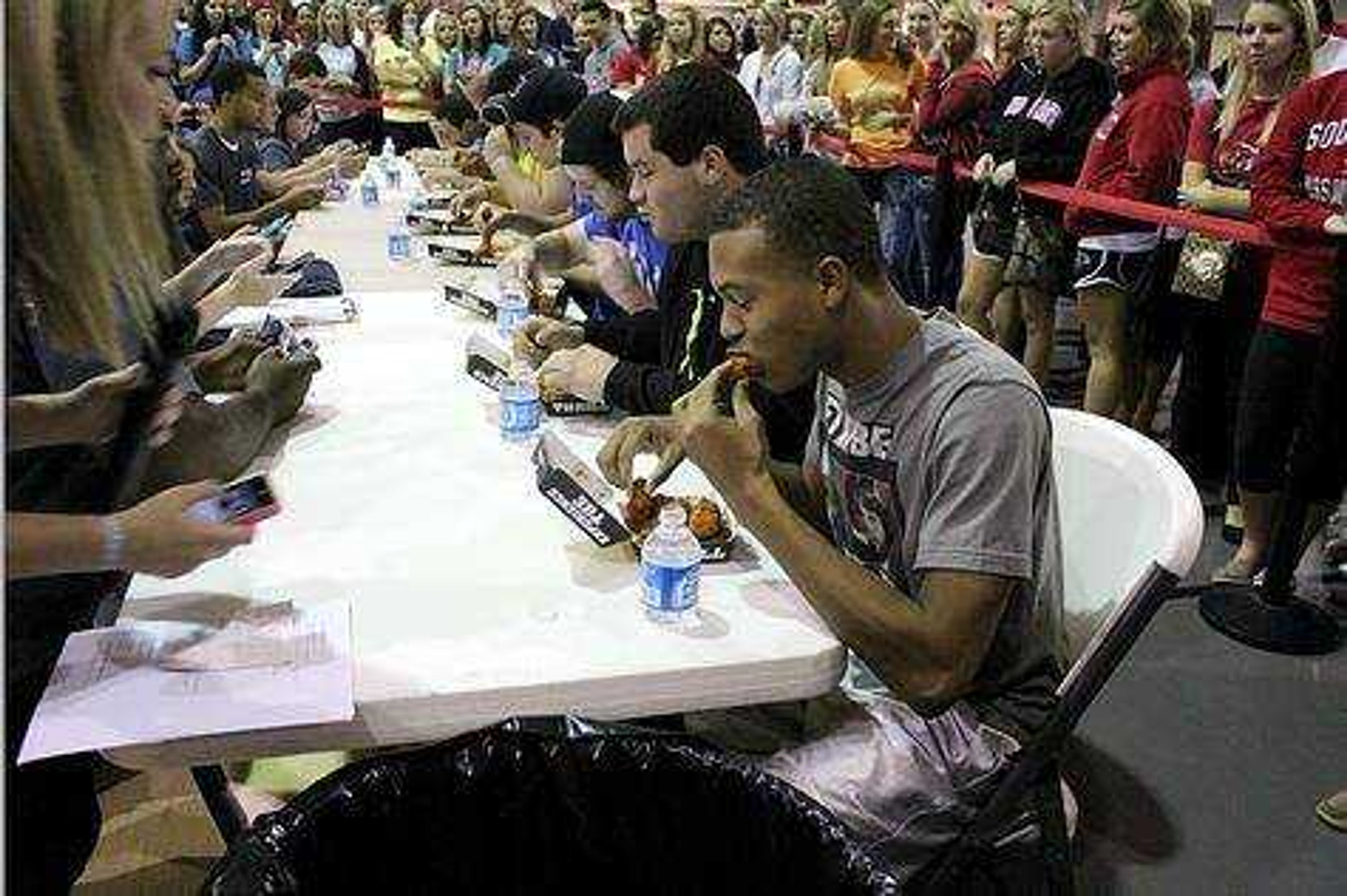 Student's participating in the Buffalo Wild Wings eating competition. Photo by Ashley Reed