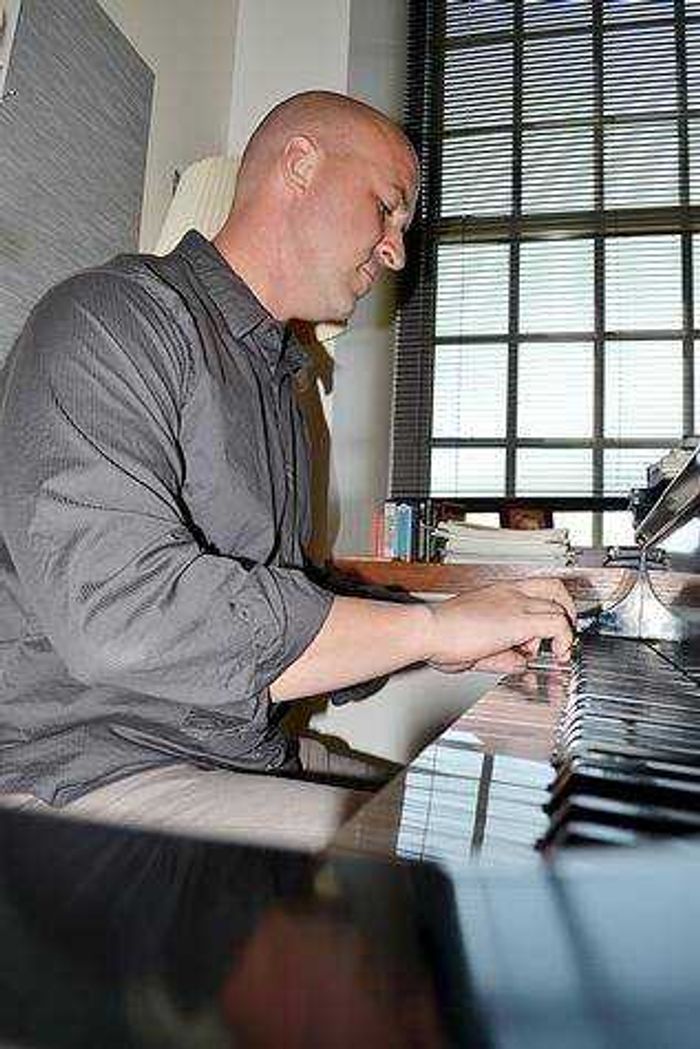 Matt Yount rehearsing in his office. Photo by Amber Hawkins