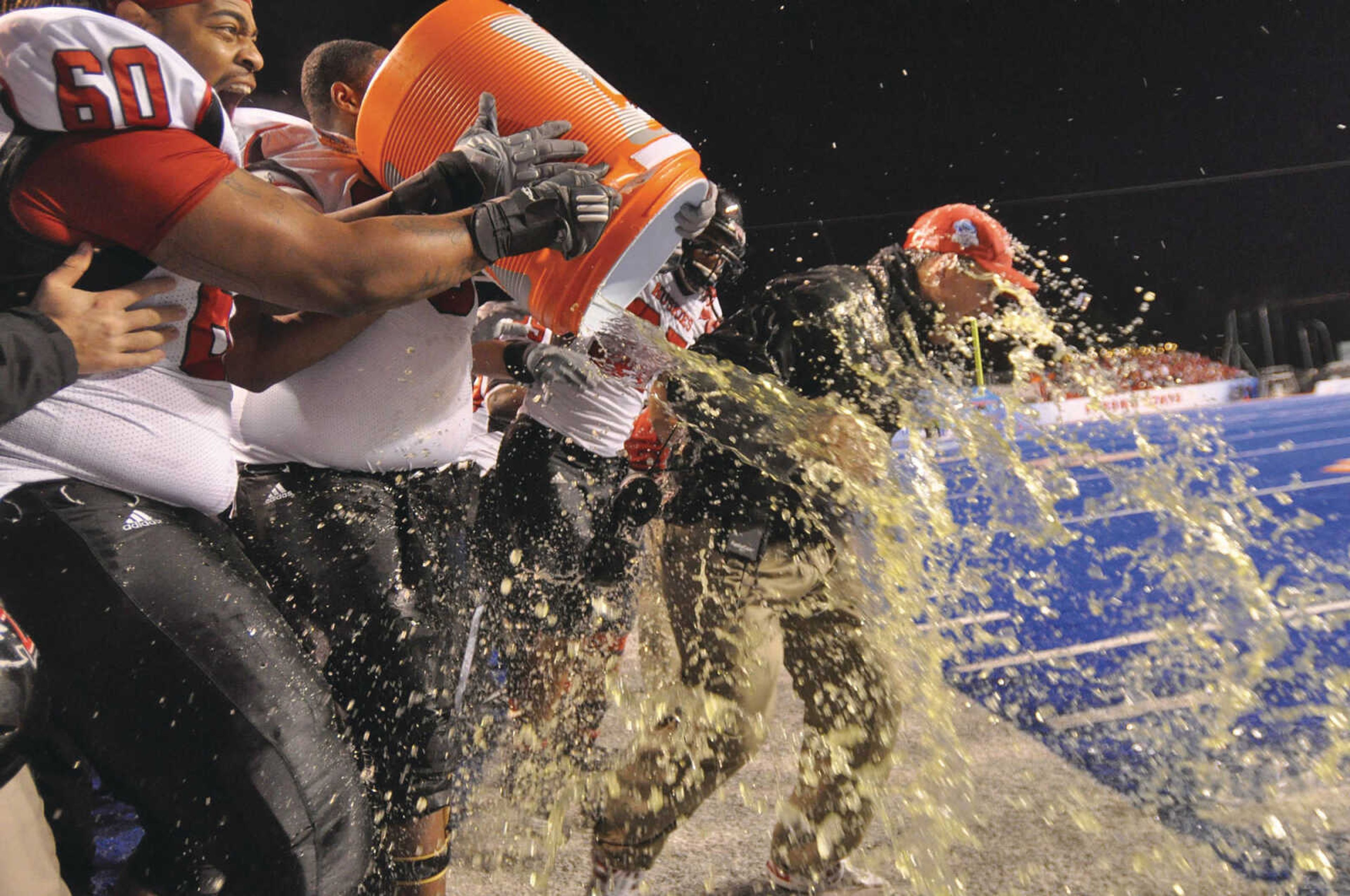 Tom Matukewicz got drenched after leading his former team, the NIU Huskies, to win the Humanitarian Bowl in 2010. Photo by Charlie Litchfield courtesy of Idaho Press Tribune