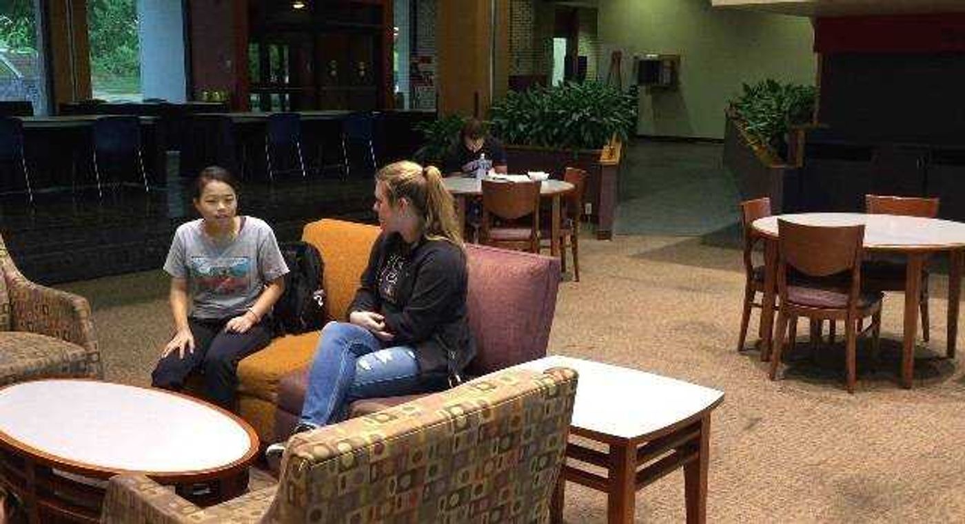 Chisato Oyama (left), an exchange student from Japan, talks with Morgan White (right), her conversation partner at the University Center.