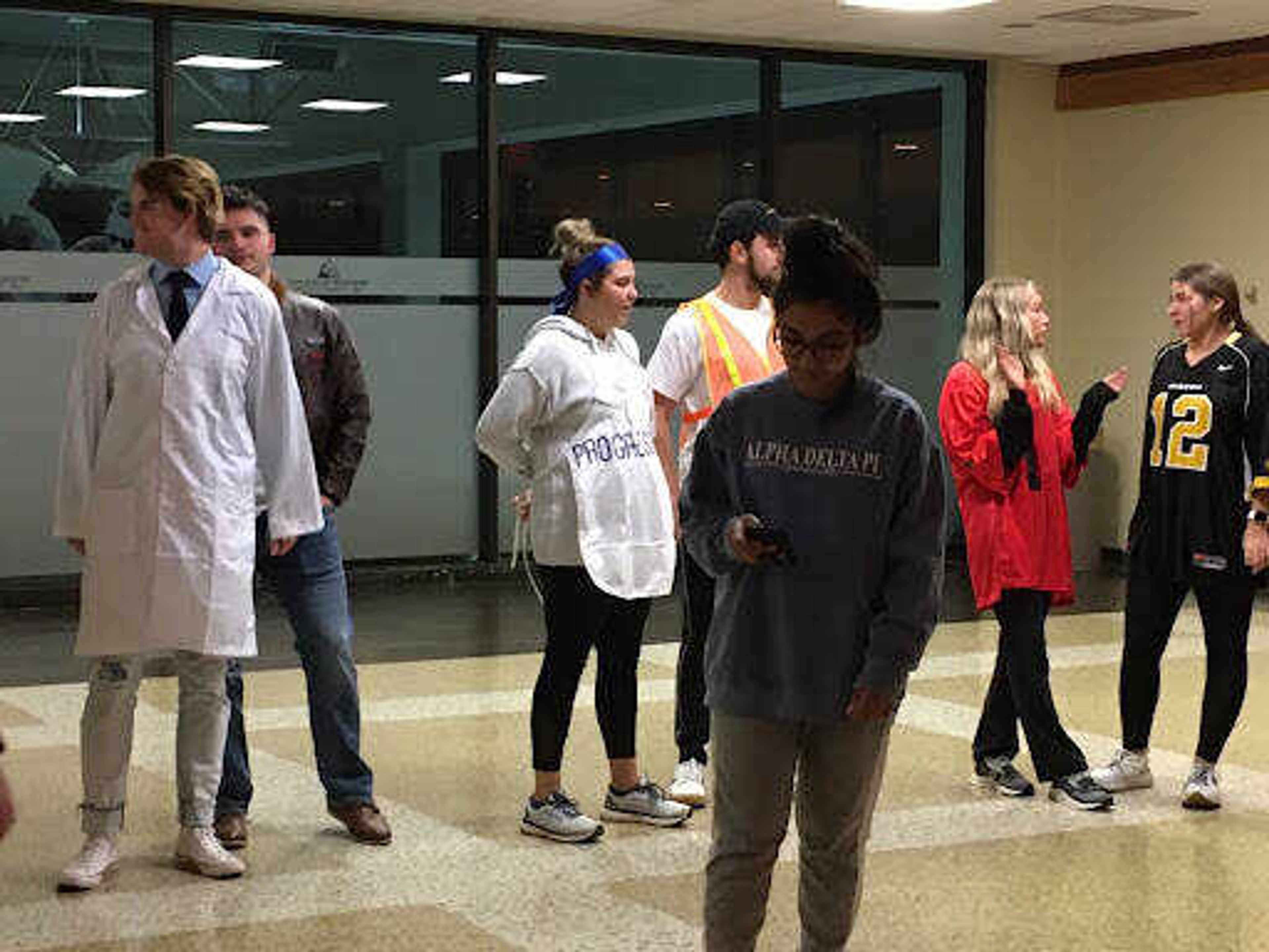 SGA members mingle after the Nov. 1 meeting, many in costume to celebrate Halloween.