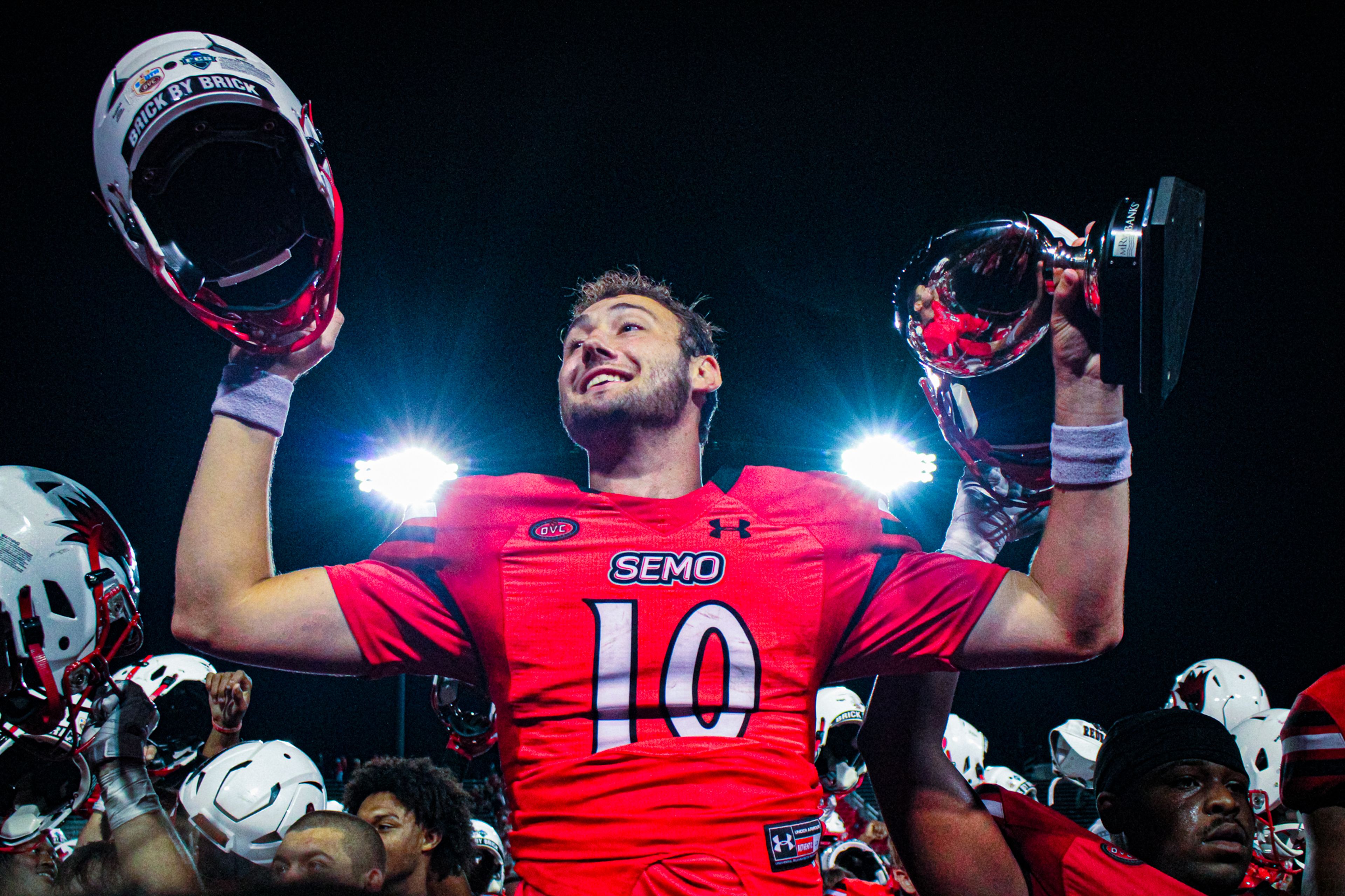 Senior quarterback Paxton DeLaurent celebrates with the team after beating Lindenwood in 2023.